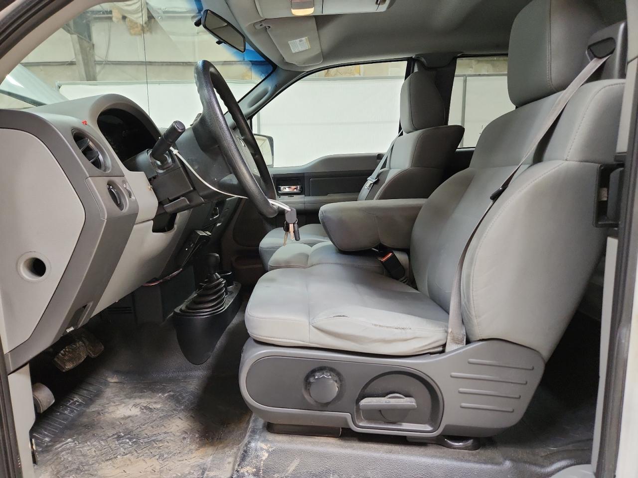 2008 Ford F150 White vin: 1FTRX14W68KC89294 Damage: Left Front Seat Cushion, Worn, Replacement Required