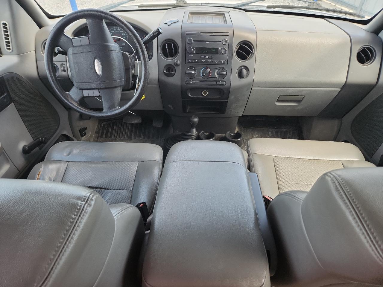 2007 Ford F150 White vin: 1FTVX14577NA37069 Damage: Left Front Seat Cushion, Torn, > 12 Inches