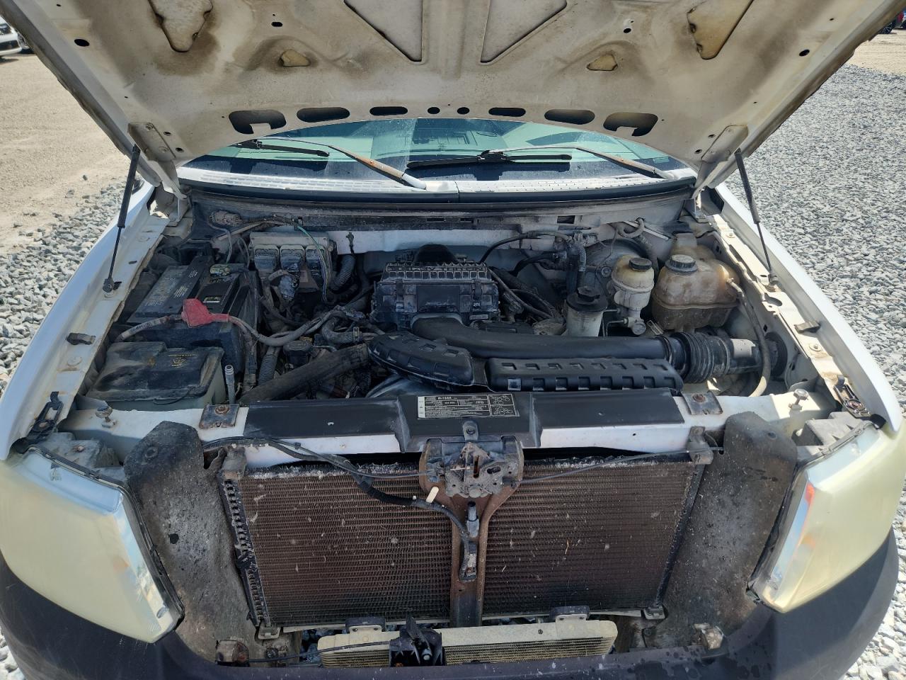 2007 Ford F150 White vin: 1FTVX14577NA37069 Damage: Left Head Lamp, Faded, Repair Required