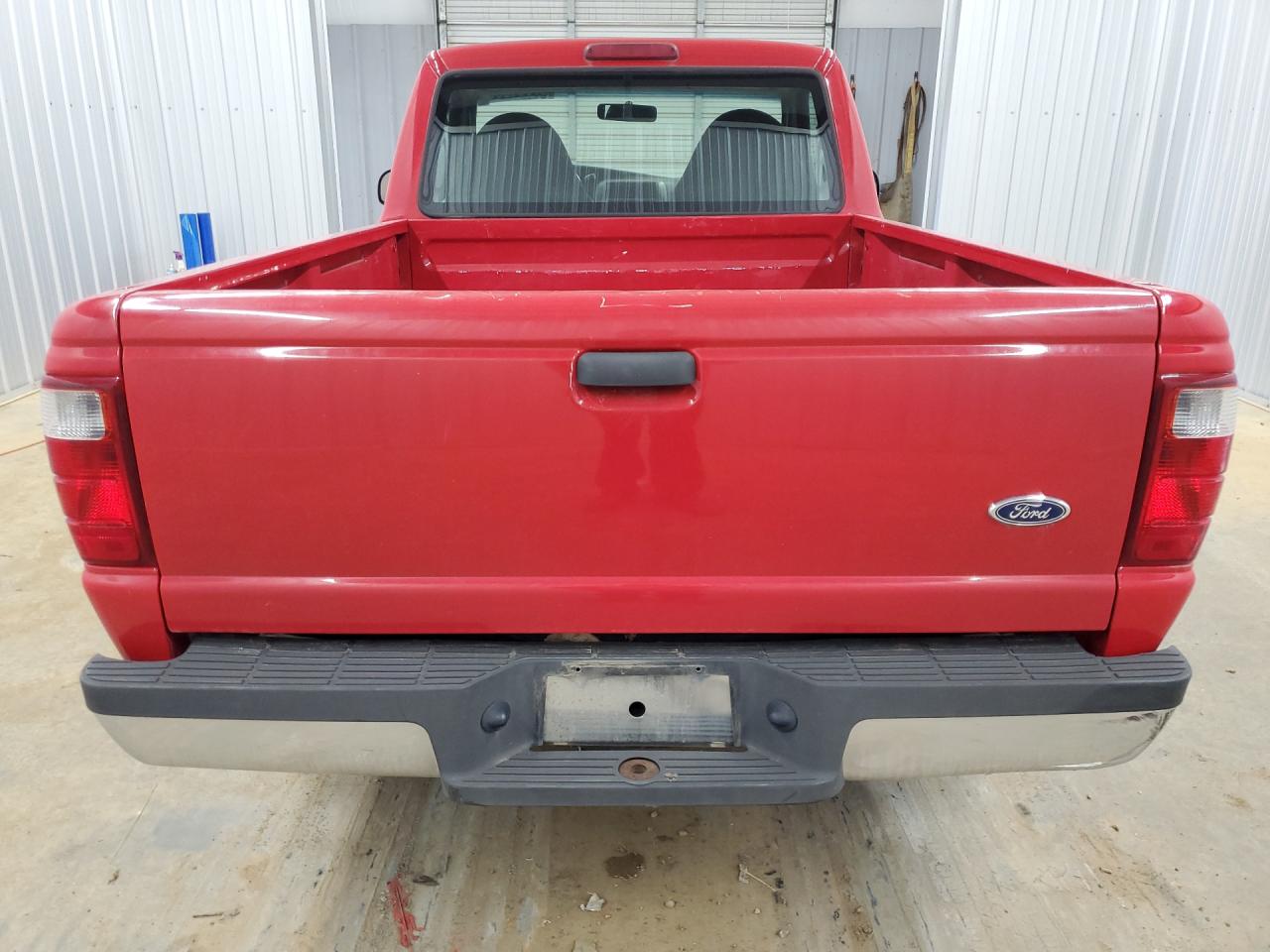 2003 Ford Ranger Red vin: 1FTYR10D13TA27700 Damage: Rear Metal Bumper Chrome, Dent(S) W/No Paint Dmg, 1 To 2 Inches