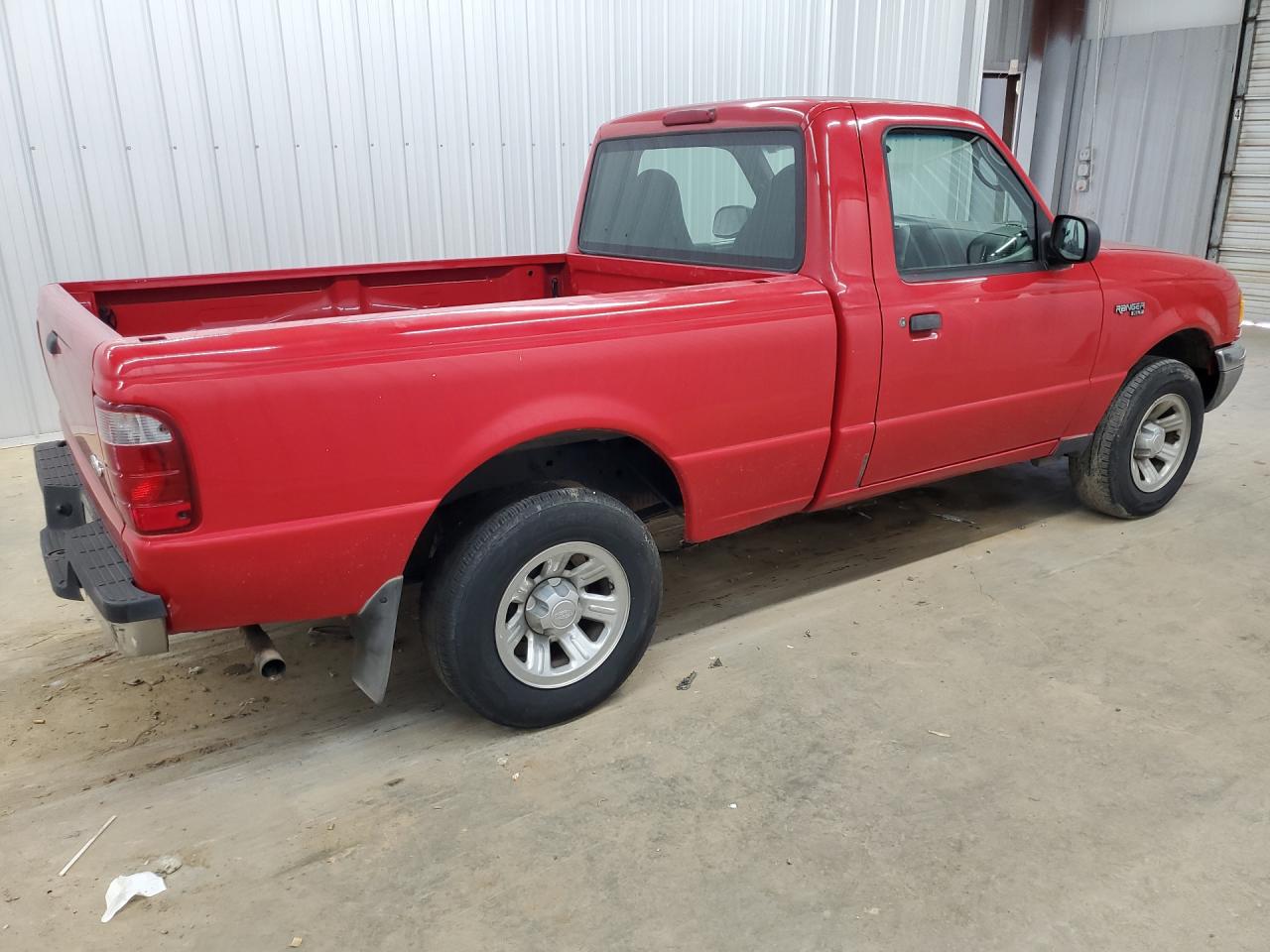 2003 Ford Ranger Red vin: 1FTYR10D13TA27700 Damage: Right Front Tire, Worn, Replacement Required