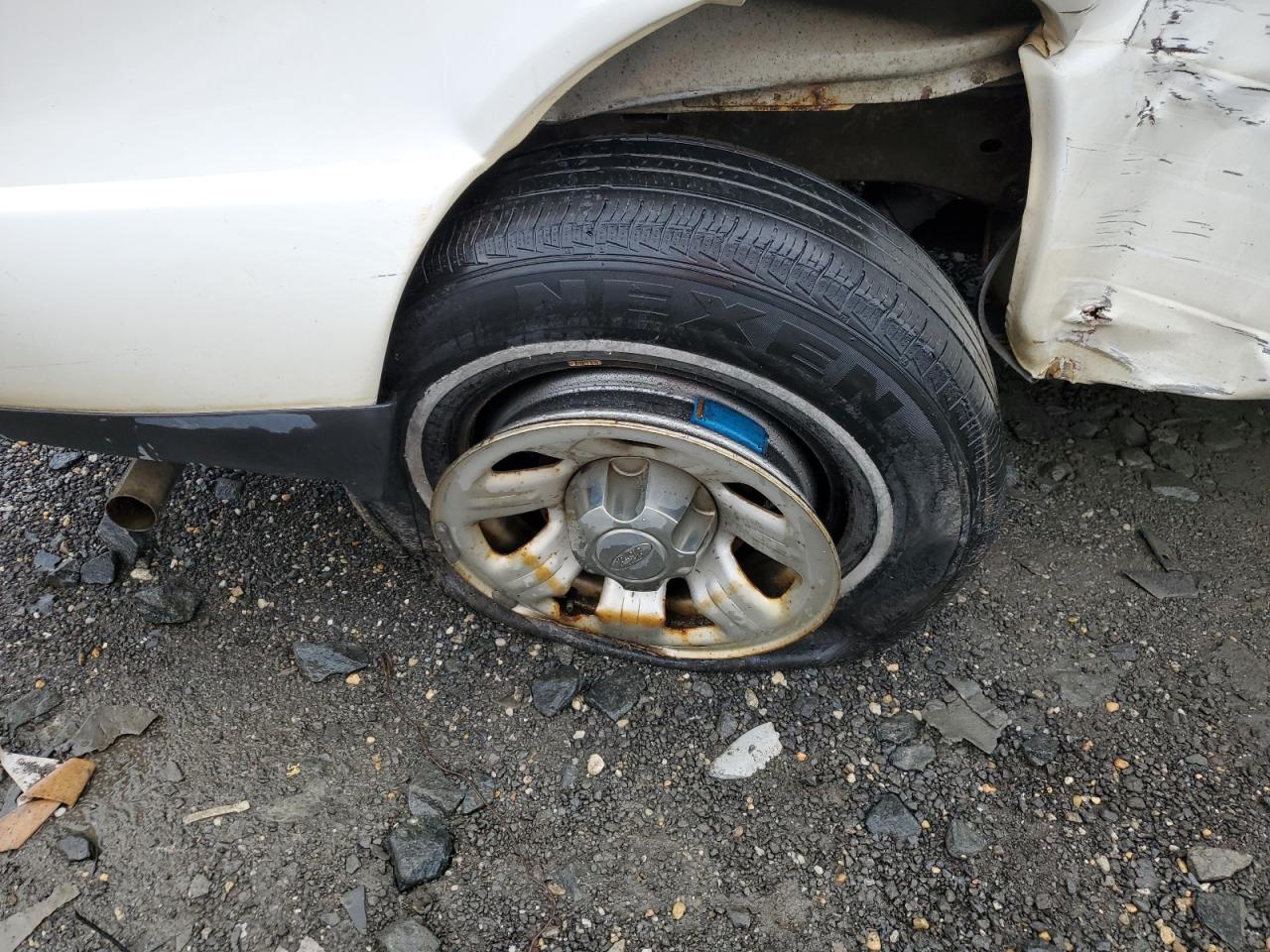 2008 Ford Ranger White vin: 1FTYR10D28PA97321 Damage: Right Rear Wheel, Corrosion, > 12 Inches