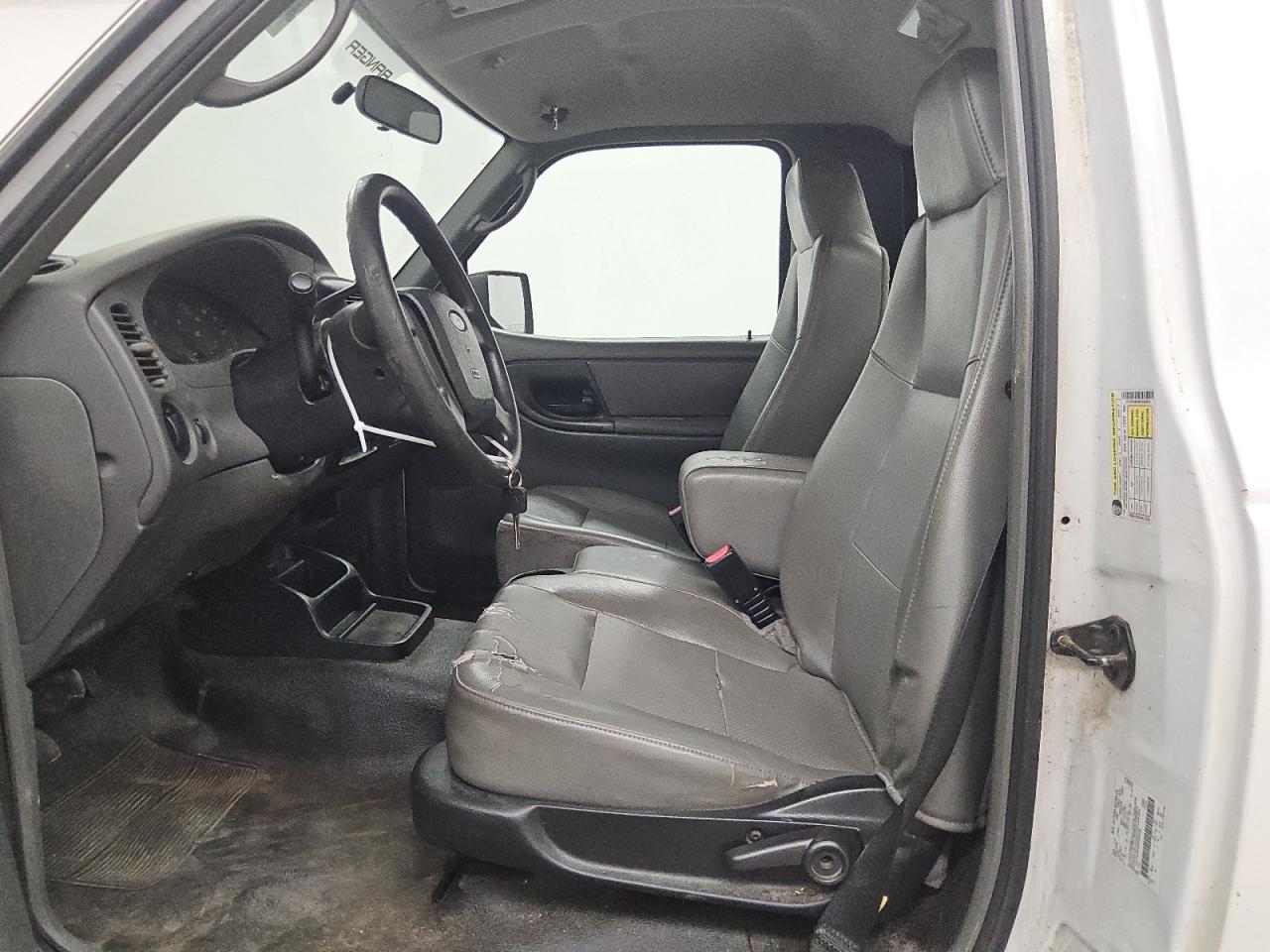 2008 Ford Ranger White vin: 1FTYR10D58PA50056 Damage: Left Front Seat Cushion, Torn, 5 To 6 Inches