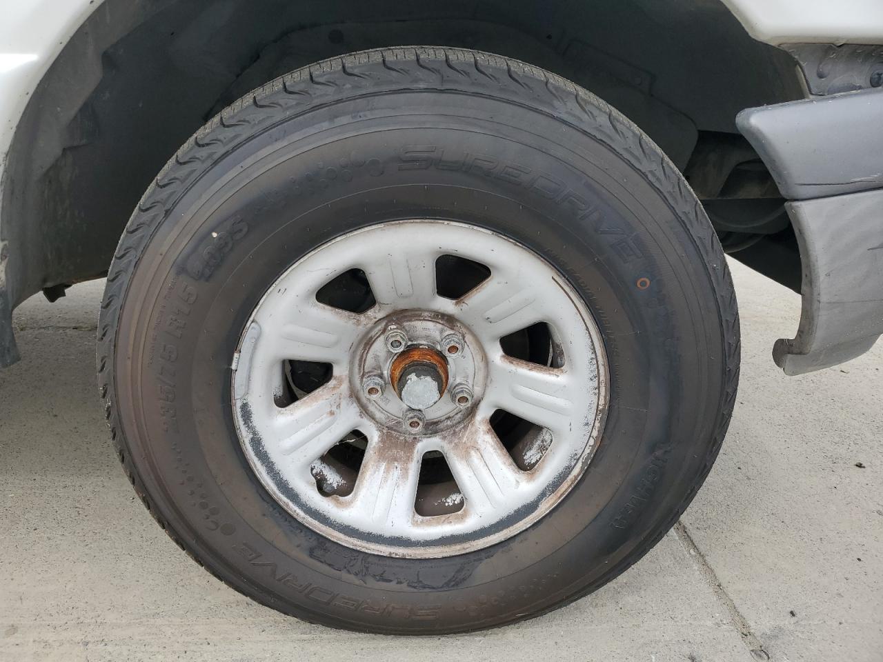 2003 Ford Ranger Super Cab White vin: 1FTYR14V93PB08620 Damage: Right Front Center Cap, Missing, Replacement Required