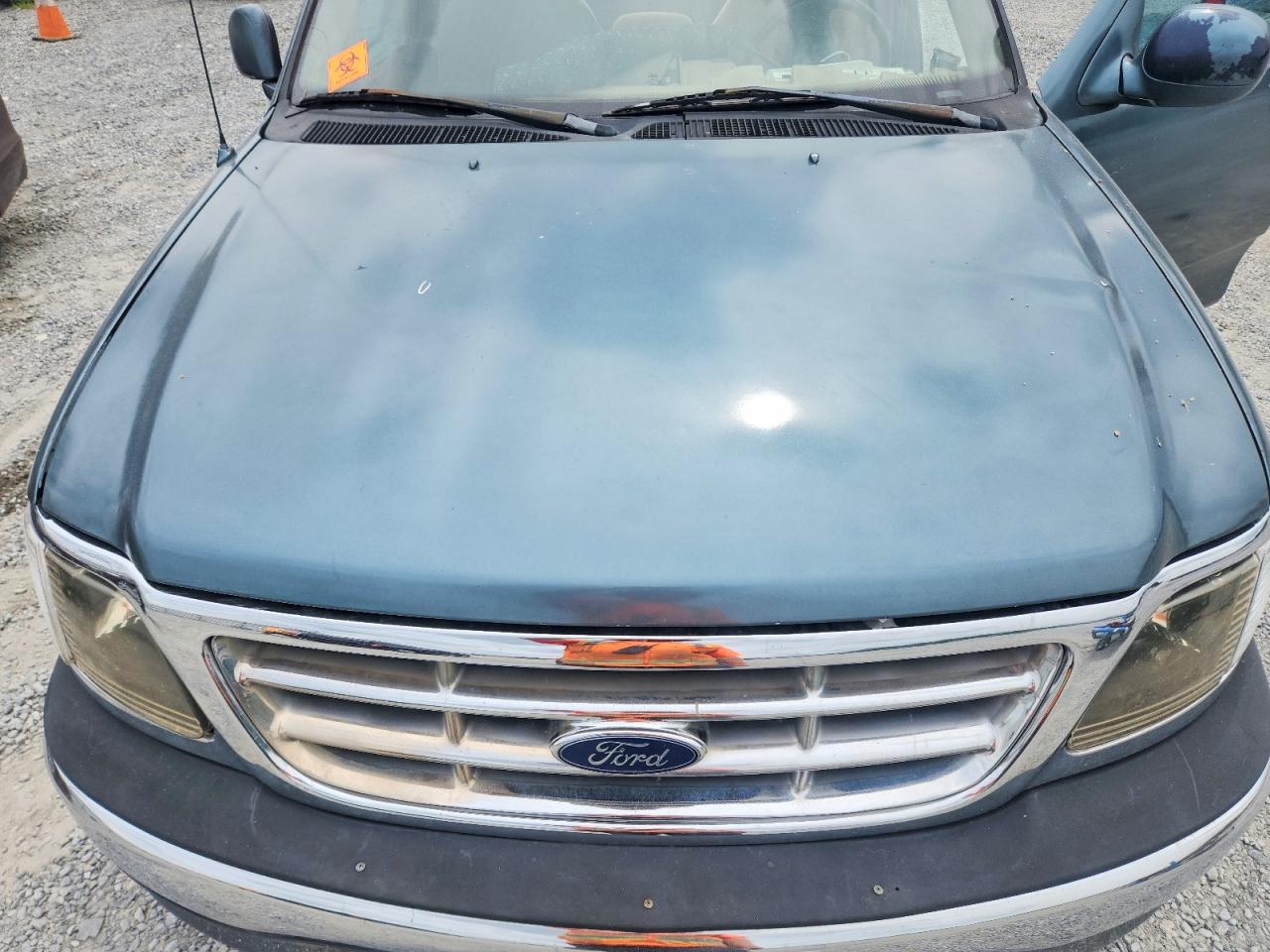 1999 Ford F150 Blue vin: 1FTZF1729XNA68877