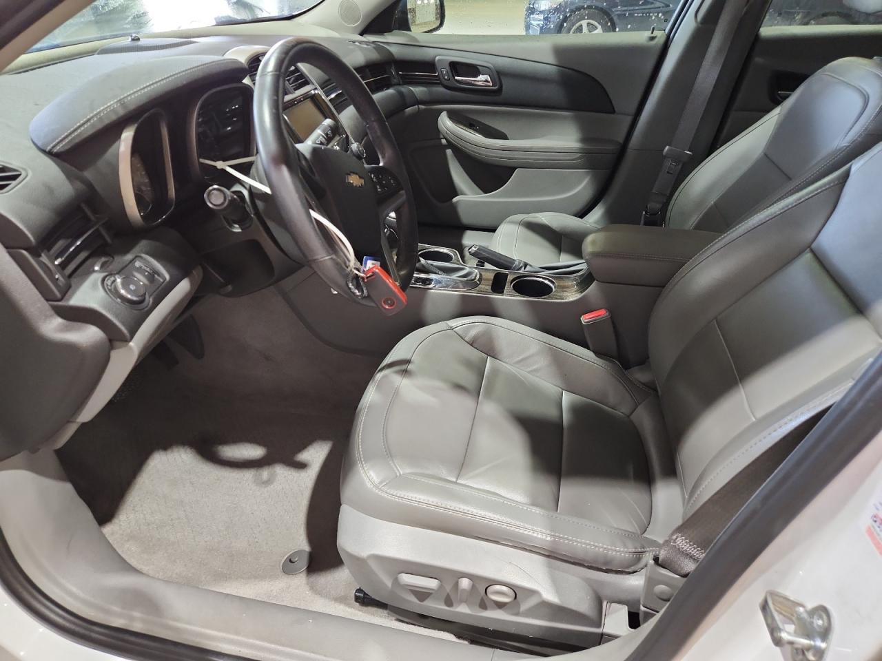 2015 Chevrolet Malibu 2lt White vin: 1G11D5SL0FF254500 Damage: Left Front Seat Cushion, Torn, > 12 Inches