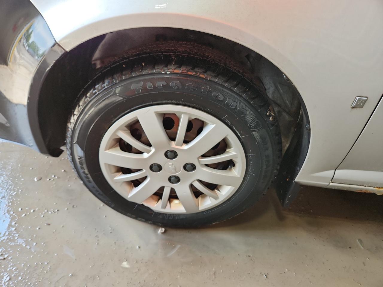 2009 Chevrolet Cobalt Ls Silver vin: 1G1AS58H397207694 Damage: Left Front Wheel Cover, Broken, Replacement Required