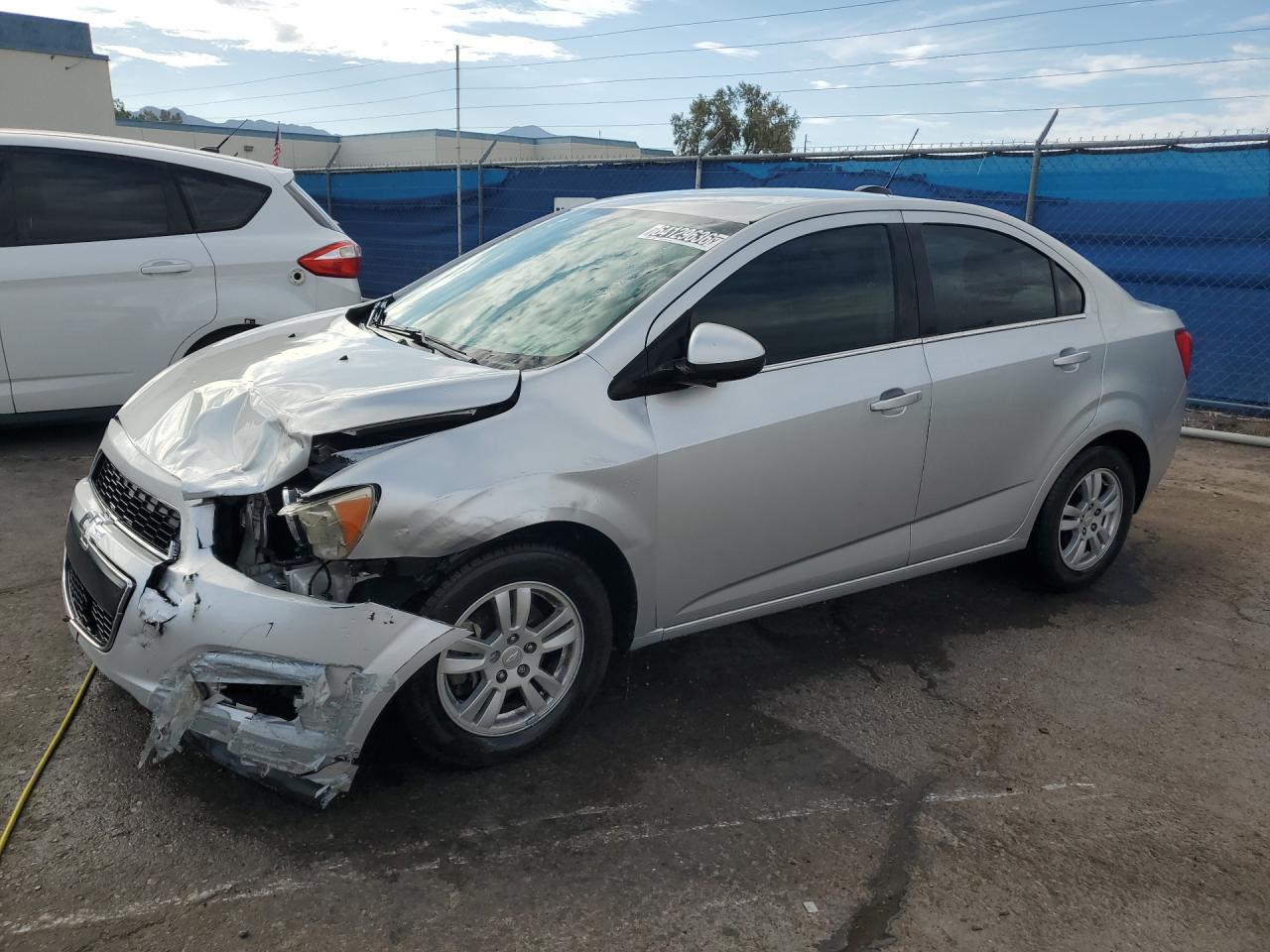 2015 Chevrolet Sonic Lt Silver vin: 1G1JC5SH3F4200506 Damage: Left Front Fender, Dent(S) W/ Paint Dmg, > 12 Inches