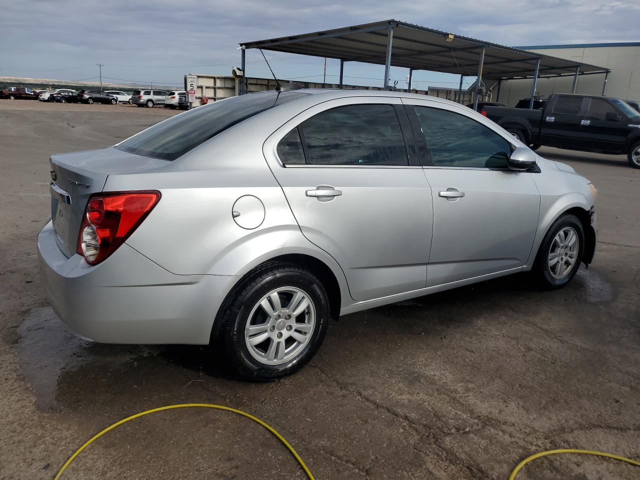 2015 Chevrolet Sonic Lt Silver vin: 1G1JC5SH3F4200506 Damage: Right Qtr Panel, Dent(S) W/ Paint Dmg, 2 To 3 Inches
