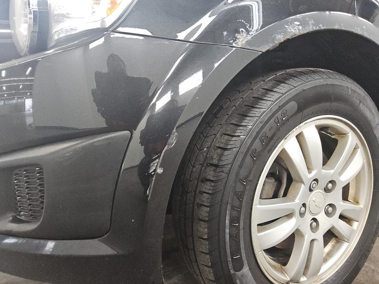 2013 Chevrolet Sonic Lt Black vin: 1G1JC5SH7D4192004 Damage: Front Bumper, Heavy Scratch, 7 To 8 Inches