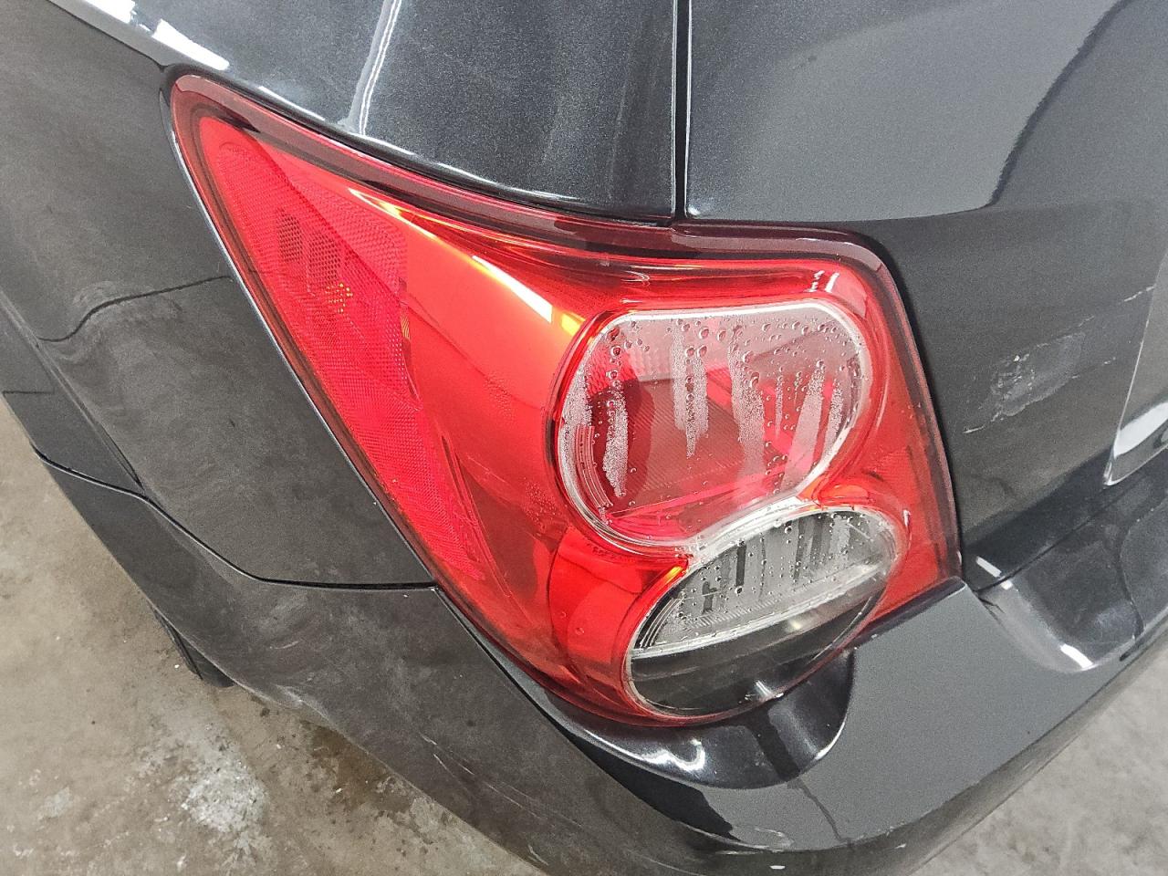 2013 Chevrolet Sonic Lt Black vin: 1G1JC5SH7D4192004 Damage: Left Tail Light, Water Damage, Replacement Required