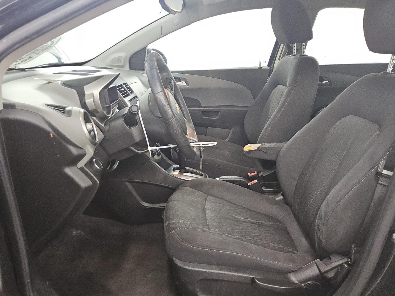 2013 Chevrolet Sonic Lt Black vin: 1G1JC5SH7D4192004 Damage: Left Front Armrest, Torn, 9 To 10 Inches