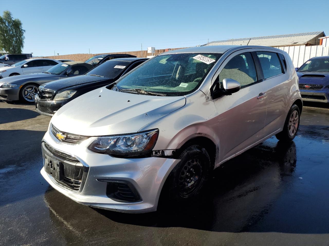 2020 Chevrolet Sonic Silver vin: 1G1JG6SB3L4131673 Damage: Left Front Fender, Dent(S) W/ Paint Dmg, > 12 Inches