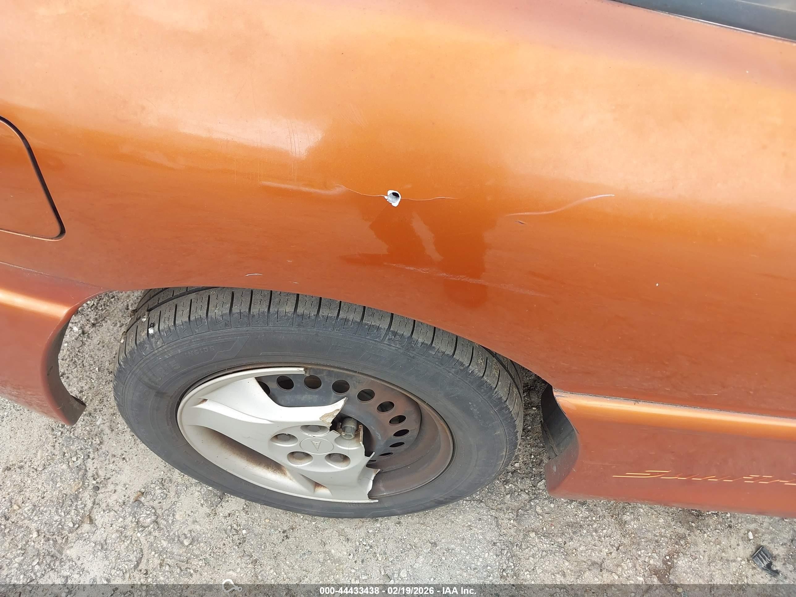 2004 Pontiac Sunfire   Orange vin: 1G2JB12F147114354