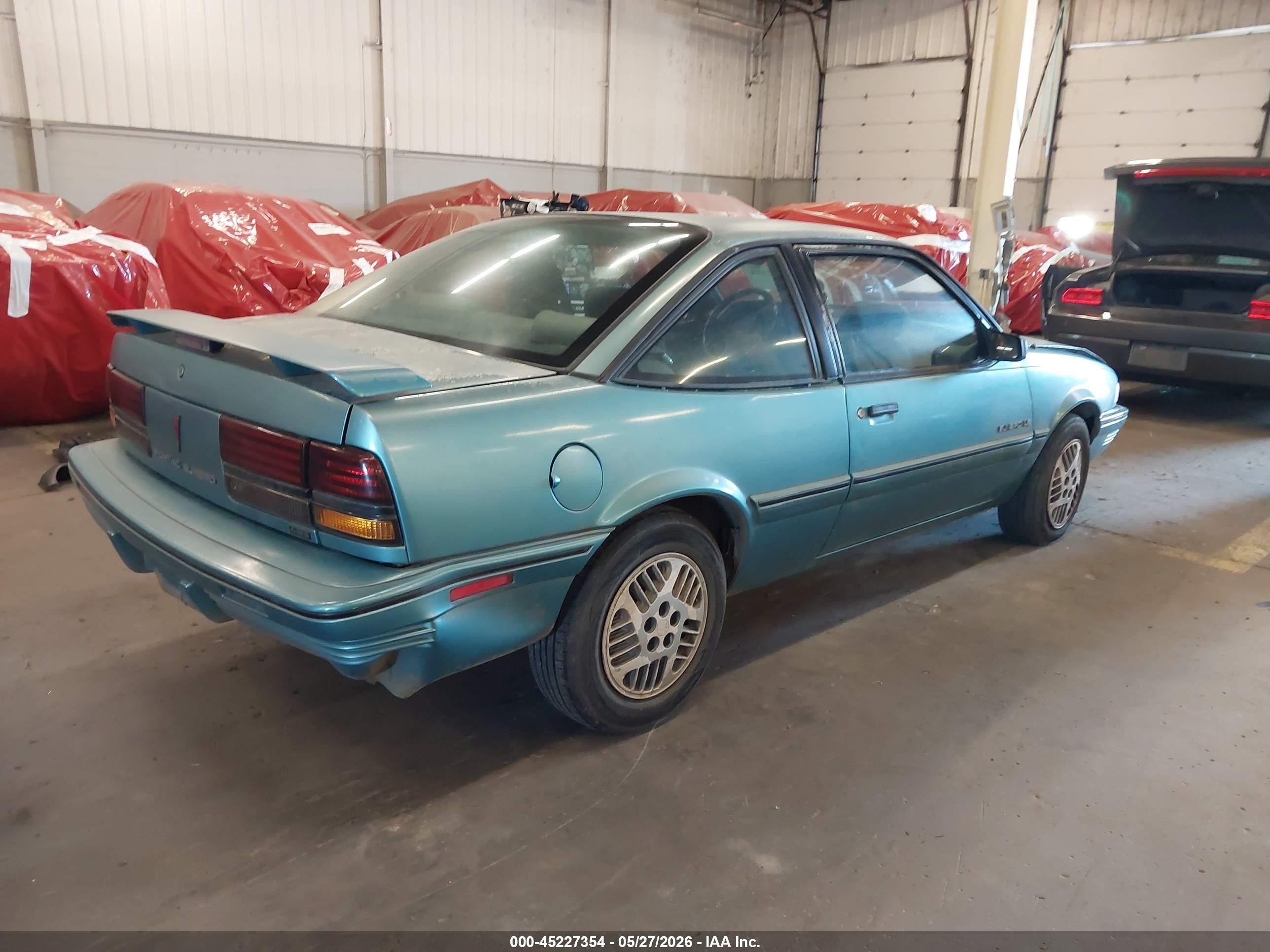 1994 Pontiac Sunbird Le Blue vin: 1G2JB14H9R7597047