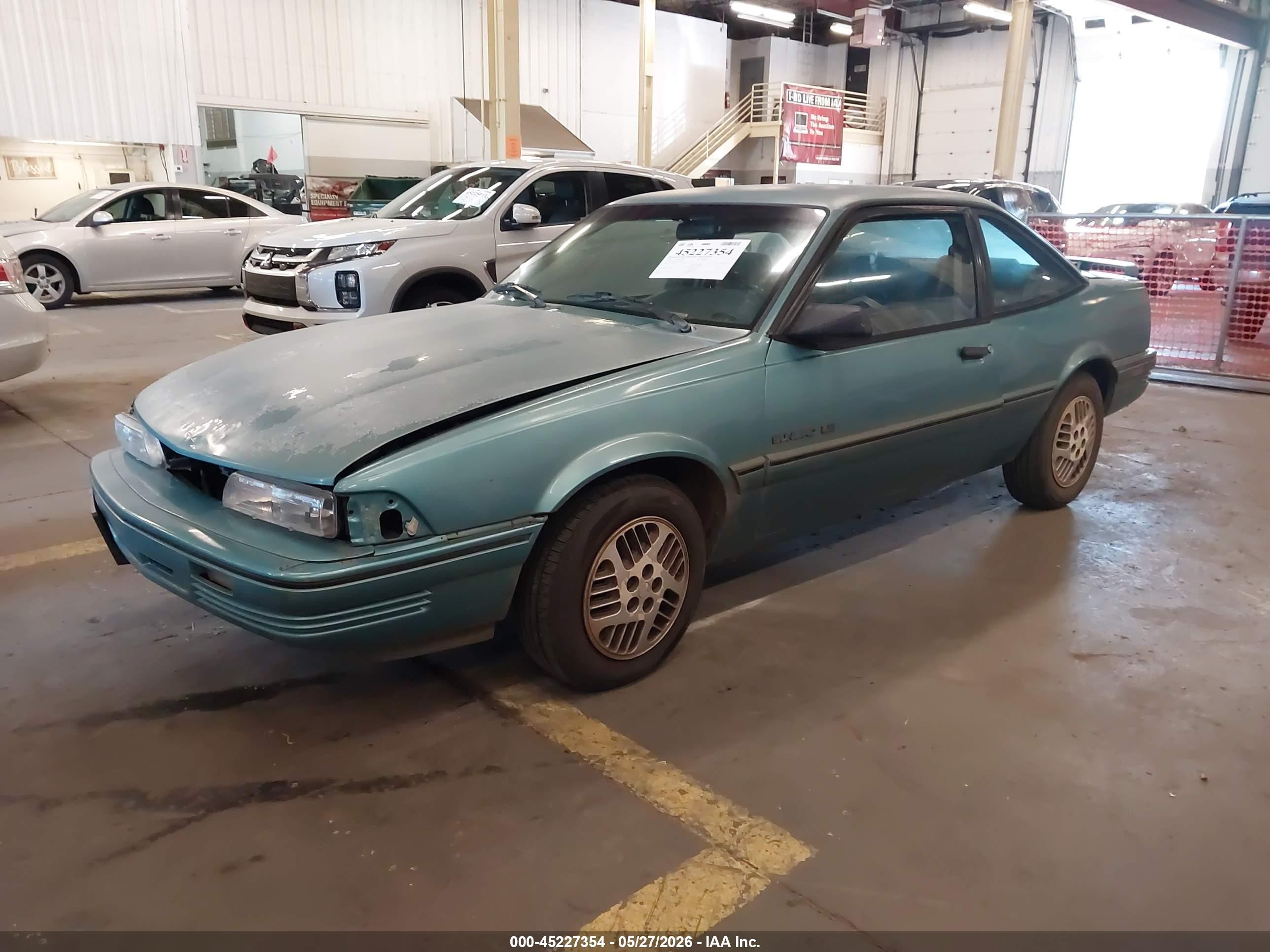1994 Pontiac Sunbird Le Blue vin: 1G2JB14H9R7597047