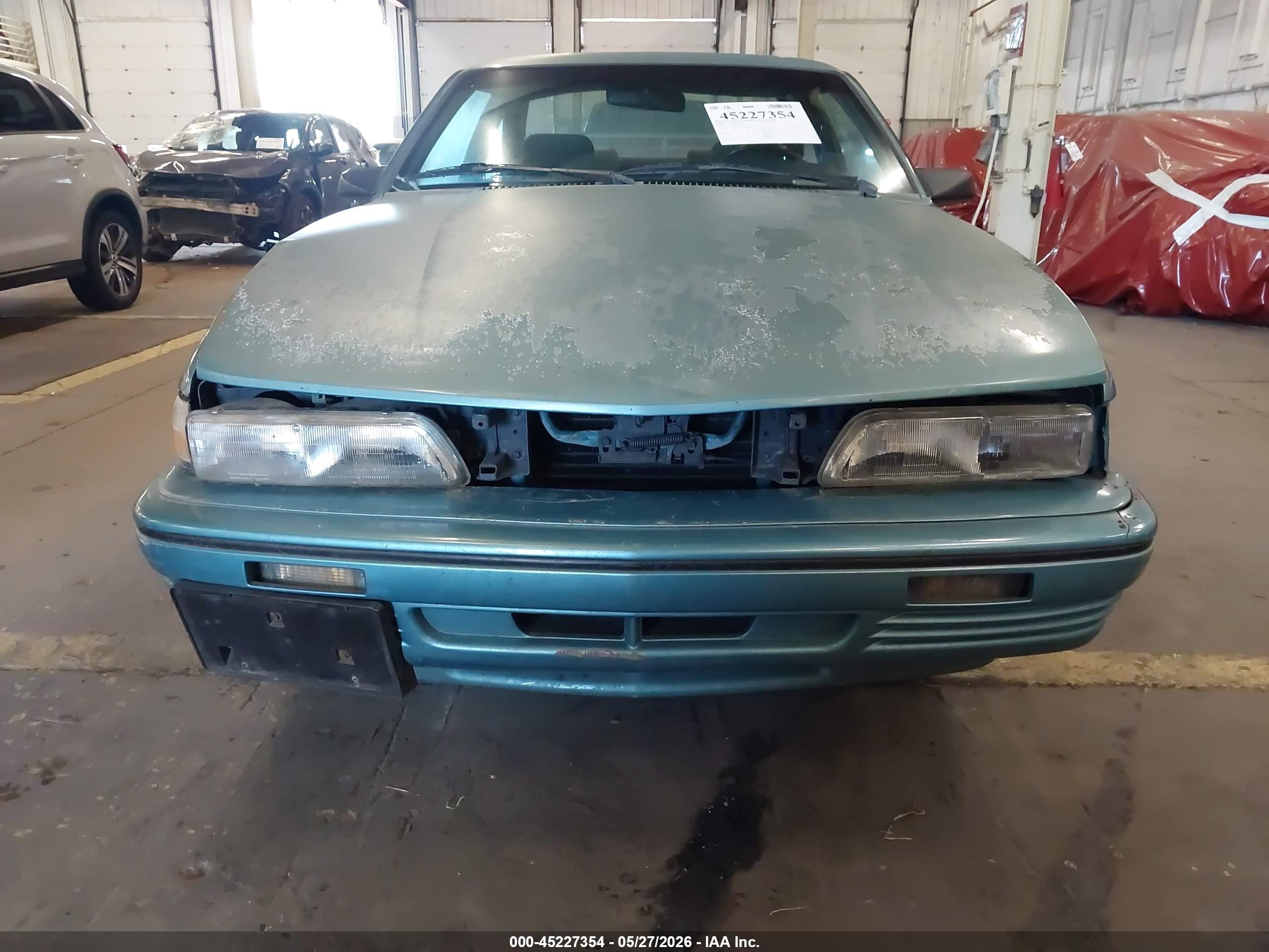 1994 Pontiac Sunbird Le Blue vin: 1G2JB14H9R7597047