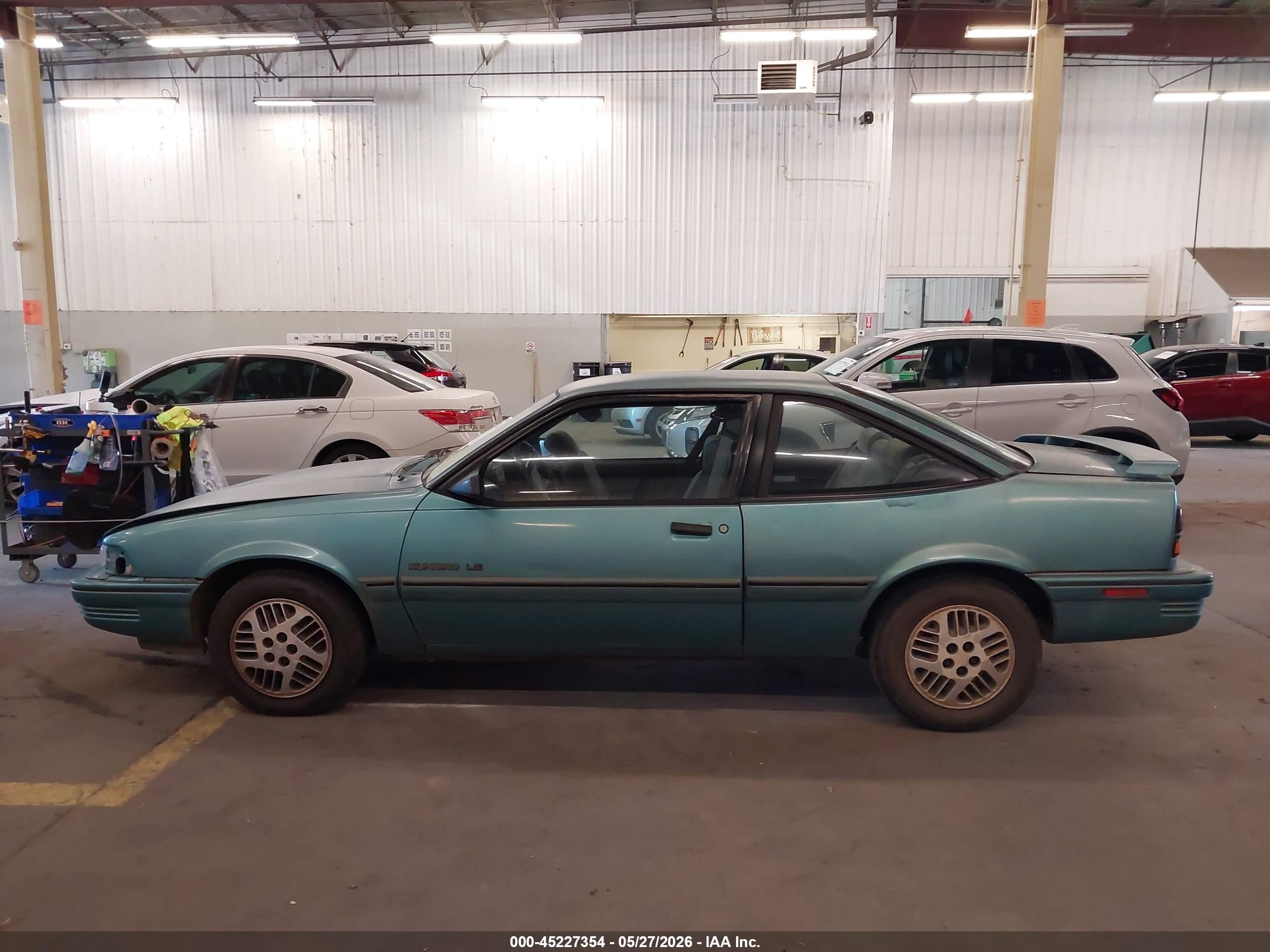 1994 Pontiac Sunbird Le Blue vin: 1G2JB14H9R7597047