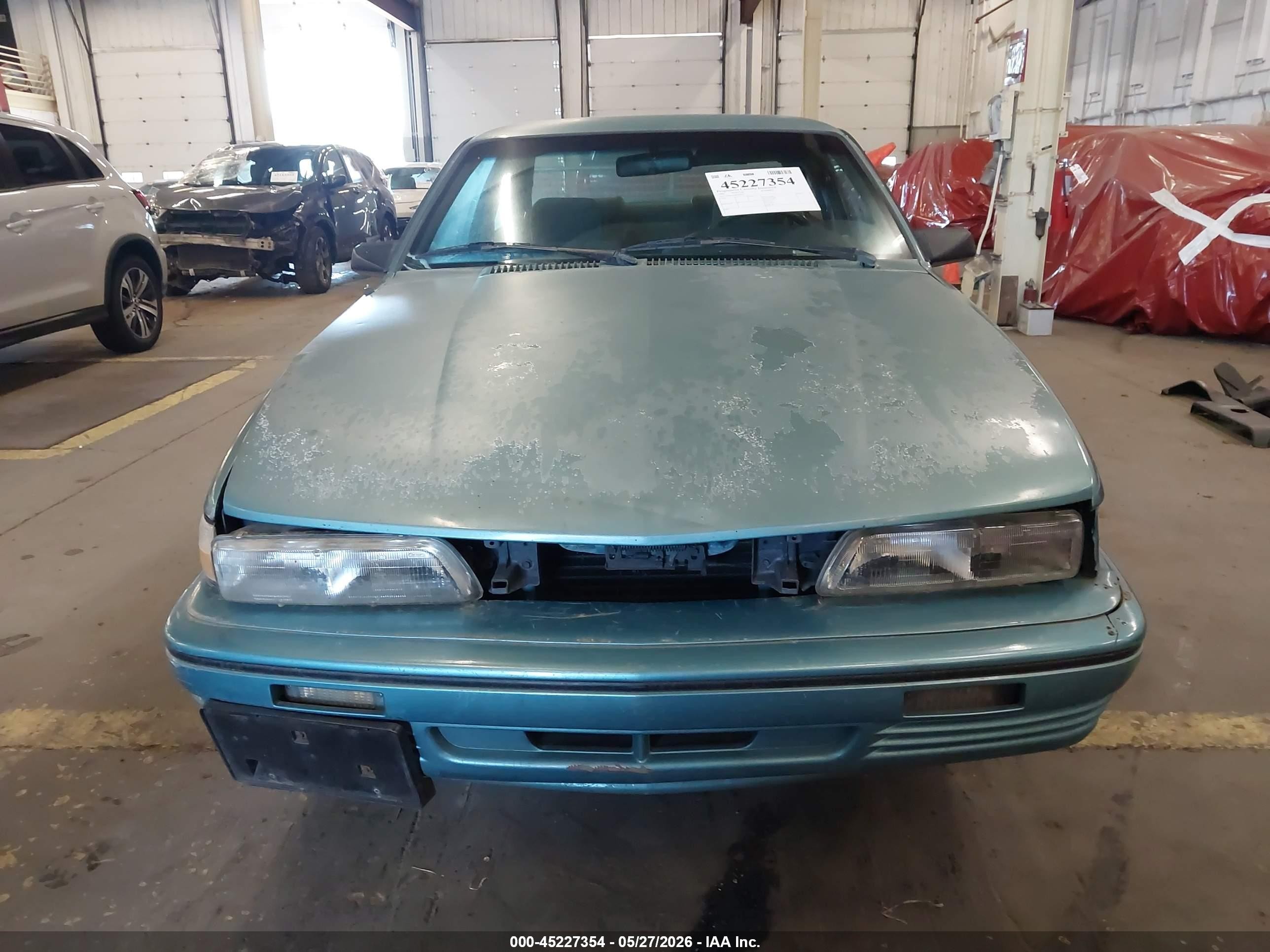 1994 Pontiac Sunbird Le Blue vin: 1G2JB14H9R7597047