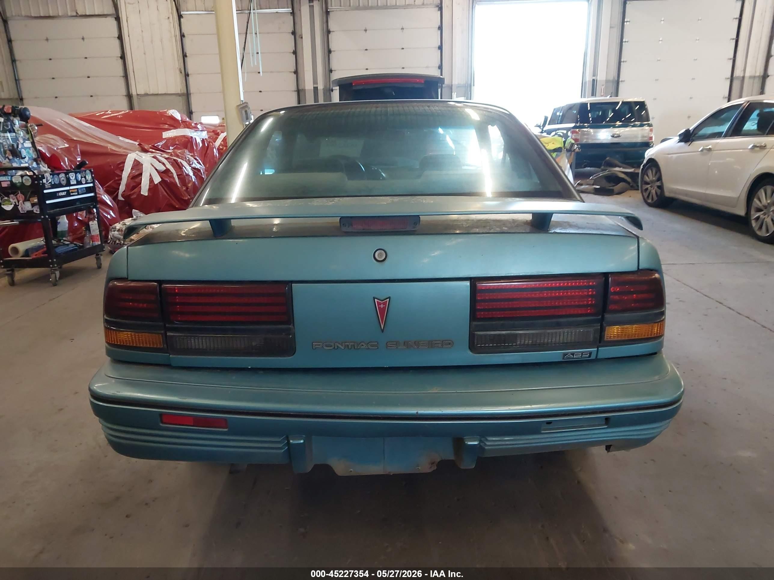 1994 Pontiac Sunbird Le Blue vin: 1G2JB14H9R7597047