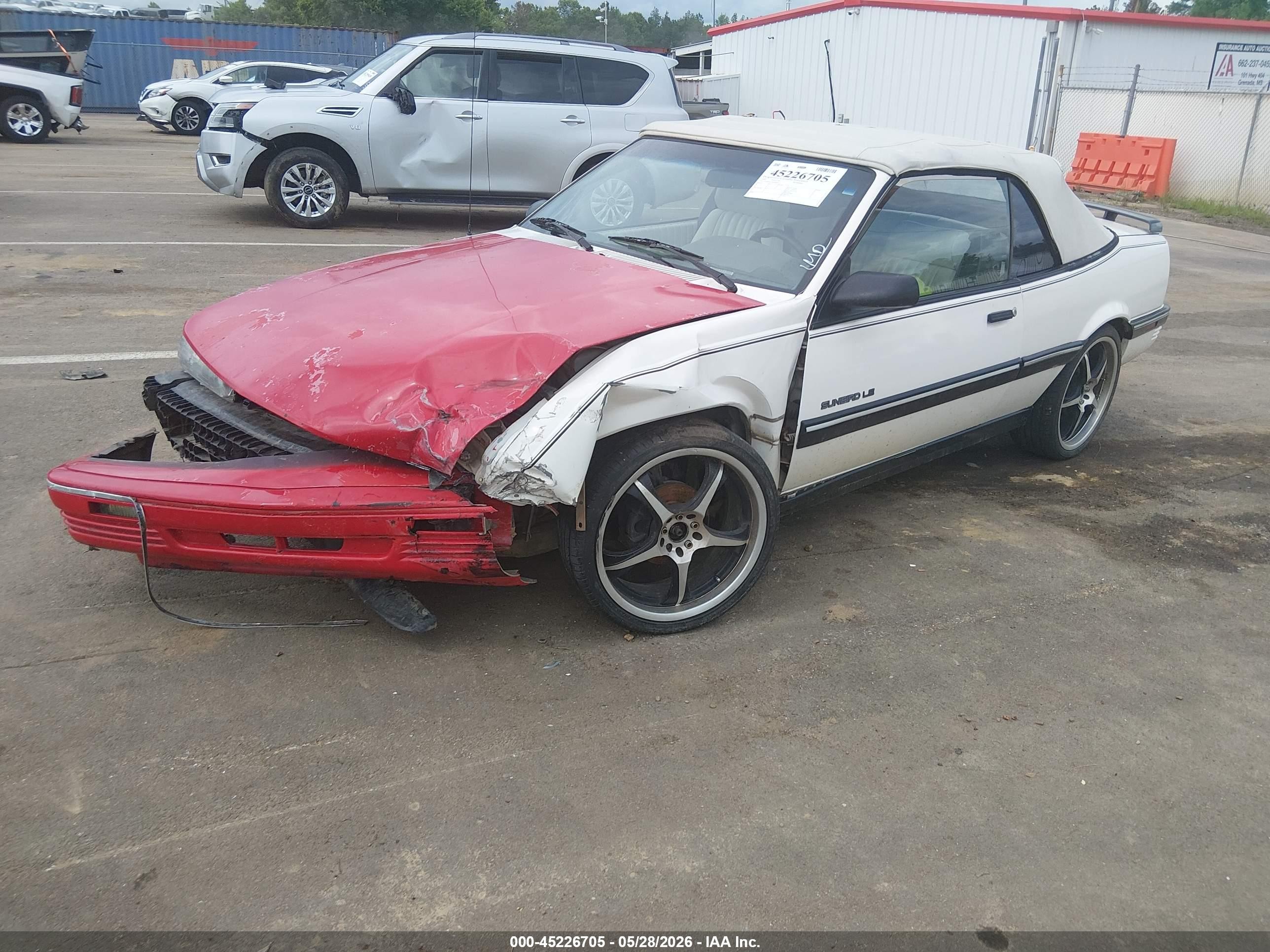 1991 Pontiac Sunbird Le Red vin: 1G2JB34T2M7609919