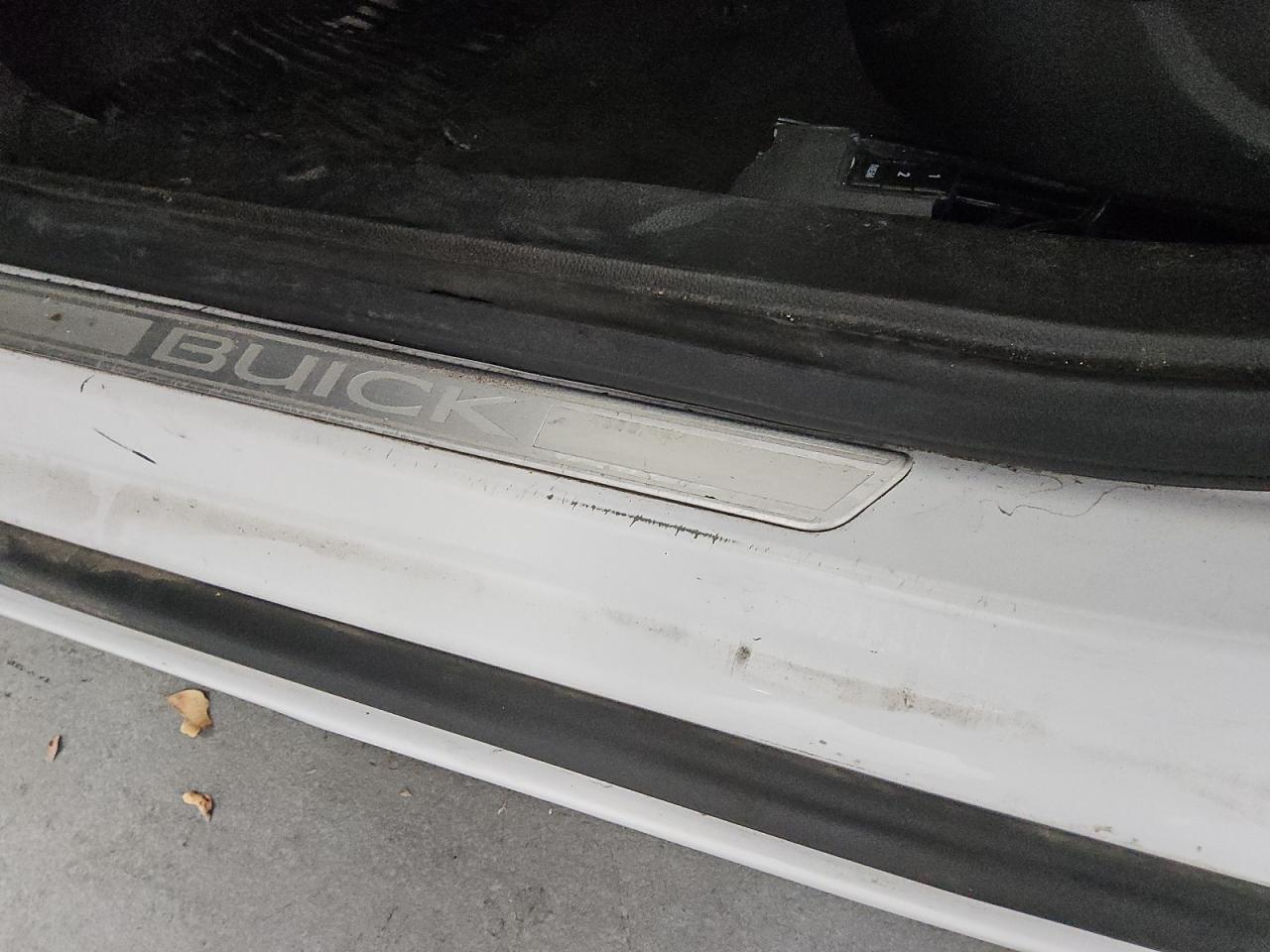 2013 Buick Lacrosse White vin: 1G4GC5E36DF162428 Damage: Left Rocker Panel, Dent(S) W/ Paint Dmg, 1 To 2 Inches