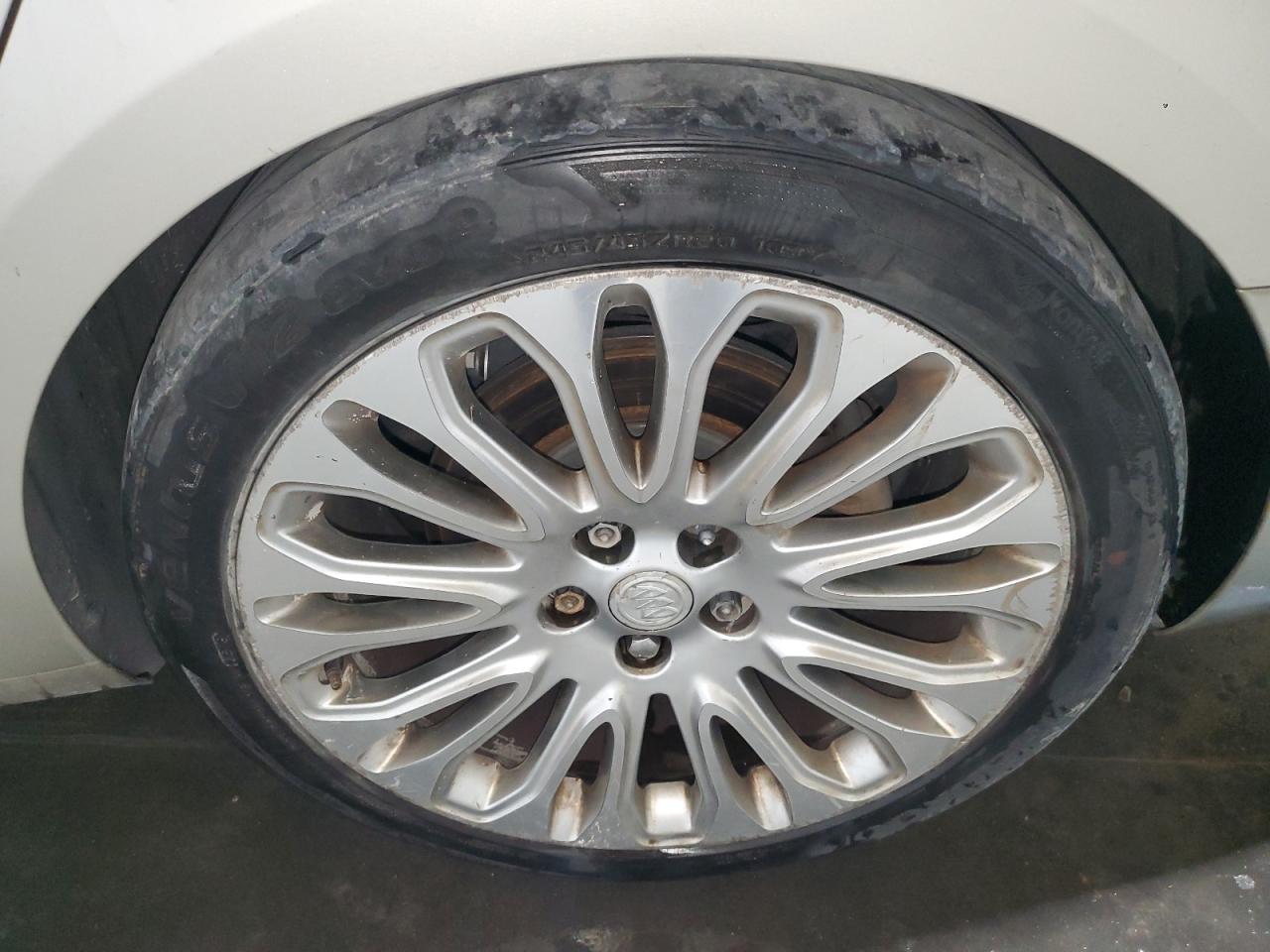 2015 Buick Lacrosse Premium Tan vin: 1G4GF5G31FF149058 Damage: Left Rear Wheel, Curb Rash, > 12 Inches