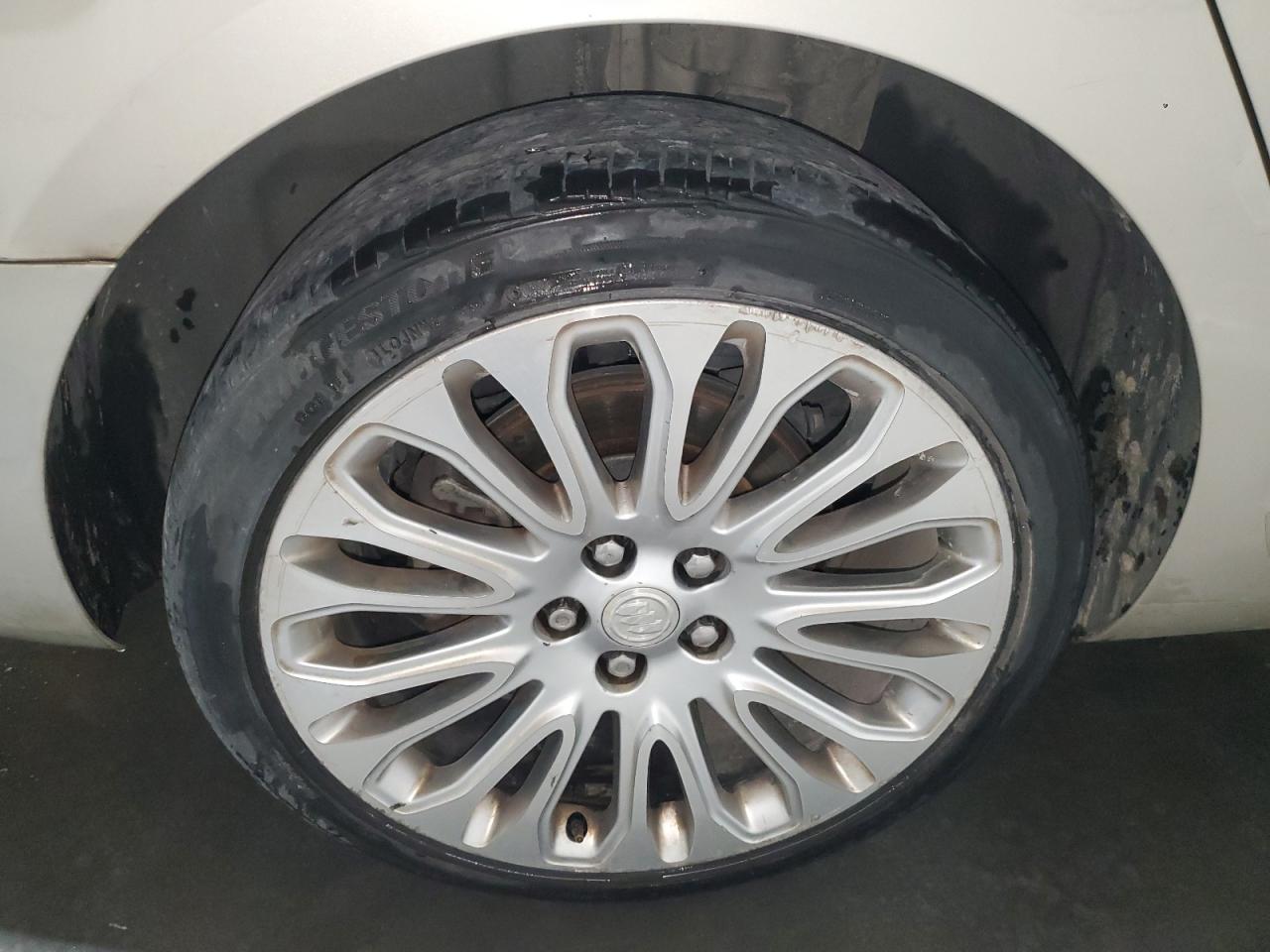 2015 Buick Lacrosse Premium Tan vin: 1G4GF5G31FF149058 Damage: Right Rear Wheel, Curb Rash, > 12 Inches