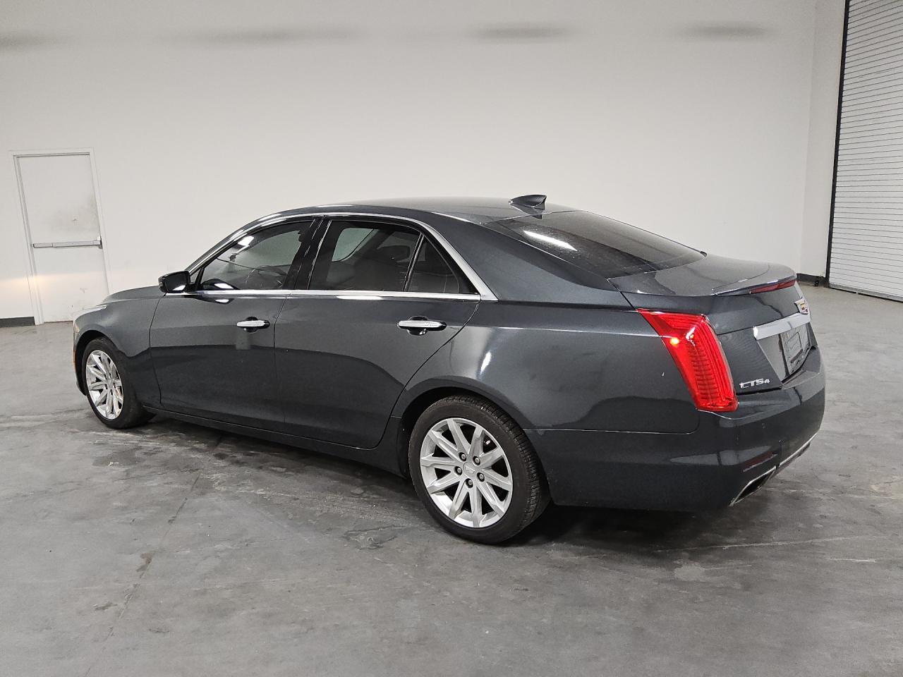 2015 Cadillac Cts Black vin: 1G6AW5SX5F0132158 Damage: Left Qtr Panel, Dent(S) W/ Paint Dmg, 1/8 To 1/2 Inch