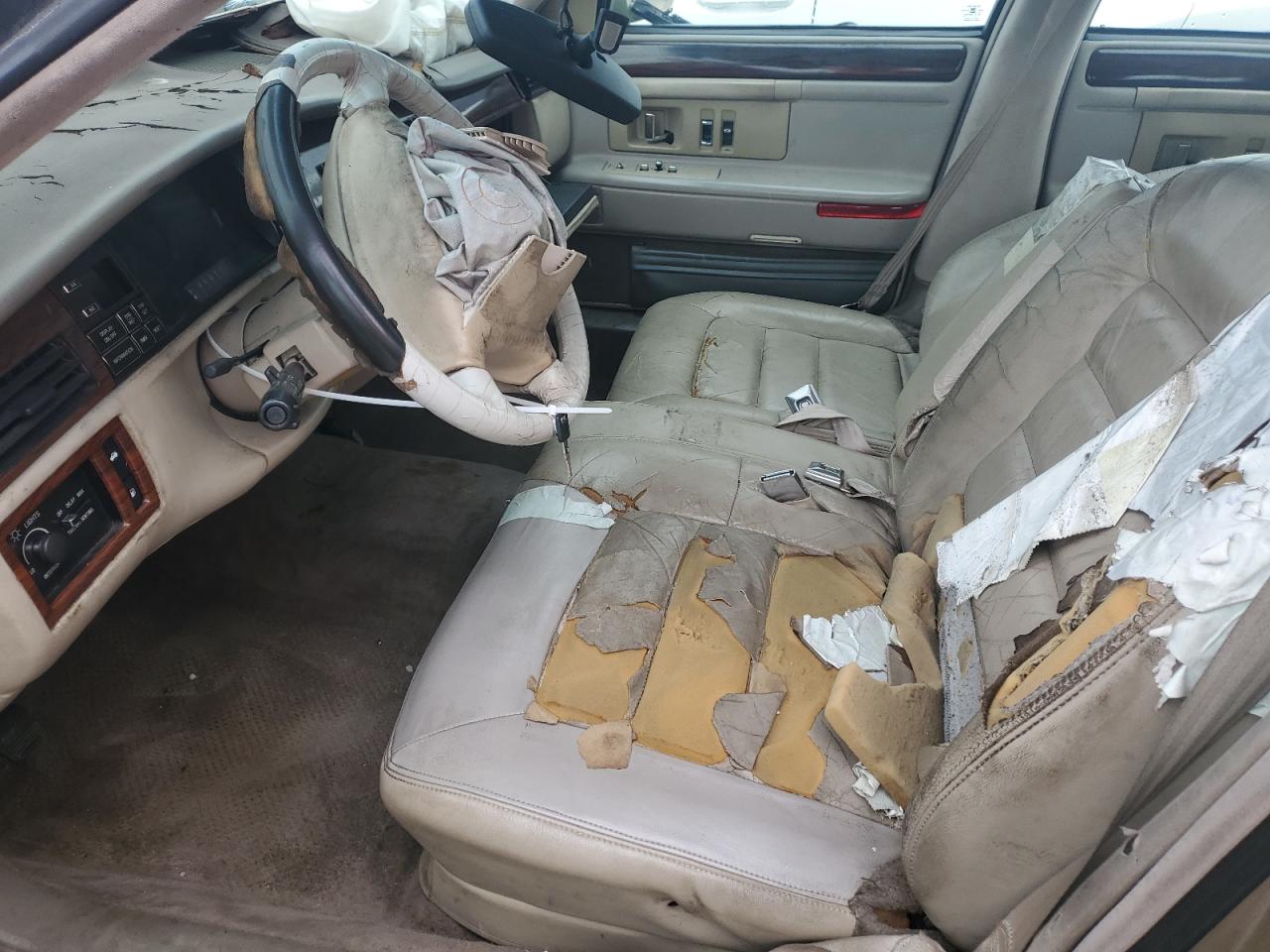 1994 Cadillac Deville Gold vin: 1G6KD52B9RU282964 Damage: Left Front Seat, Worn, Replacement Required