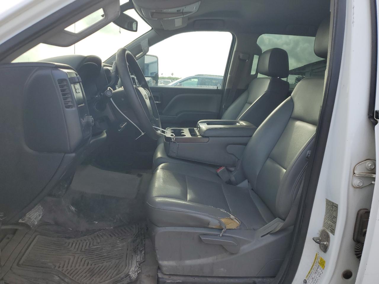 2016 Chevrolet Silverado C2500 Heavy Duty White vin: 1GC1CUEG1GF228640 Damage: Left Front Seat Cushion, Torn, 4 To 5 Inches