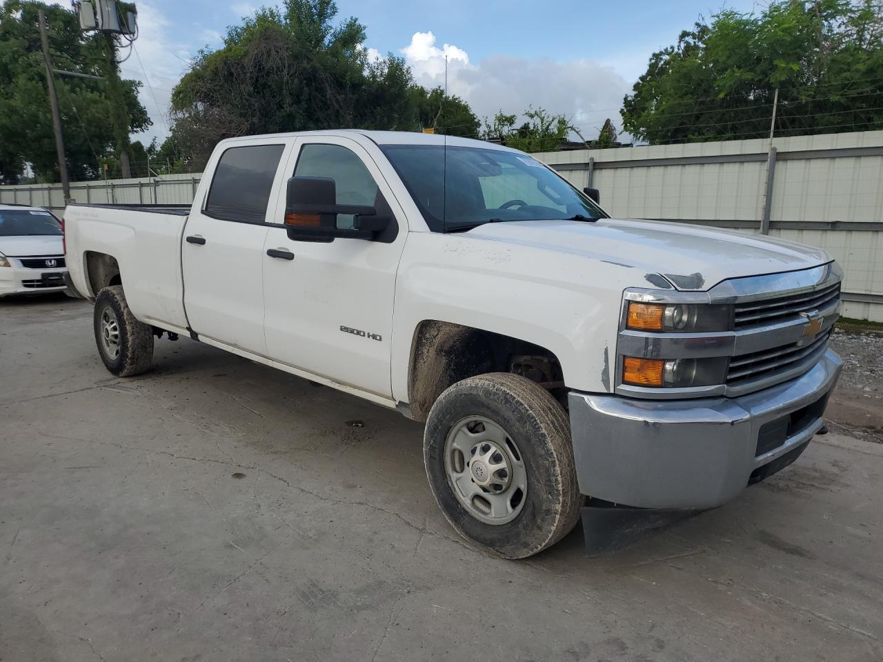 2016 Chevrolet Silverado C2500 Heavy Duty White vin: 1GC1CUEG1GF228640 Damage: Right Front Fender, Peeling, 9 To 10 Inches