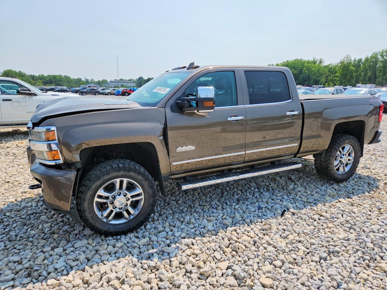 2015 Chevrolet Silverado K2500 High Country Желто-коричневый vin: 1GC1KXE89FF603802