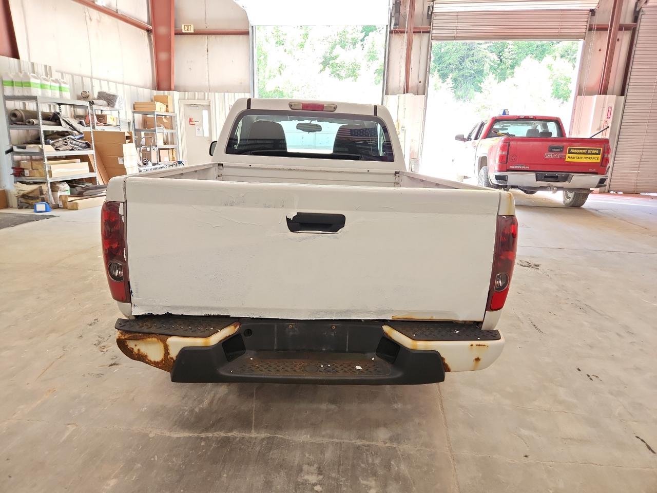 2012 Chevrolet Colorado White vin: 1GCCSBF93C8152532 Damage: Tailgate, Rust, 5 To 6 Inches
