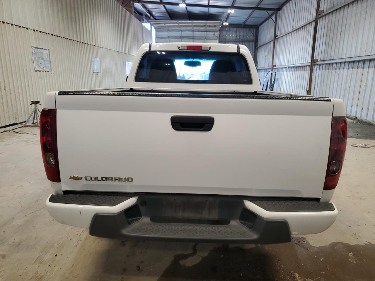 2012 Chev Colorado White vin: 1GCCSBF9XC8140121 Damage: Rear Bumper, Multiple Scratches Heavy, 2