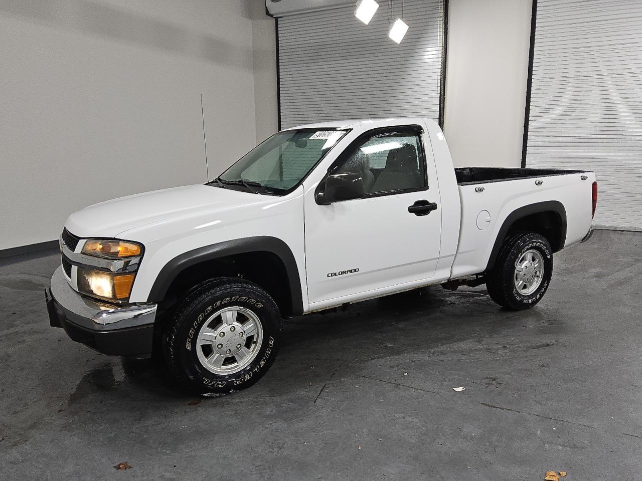 2005 Chevrolet Colorado White vin: 1GCDT146258209603 Damage: Left Front Door, Dent(S) W/No Paint Dmg, < 1/8 Inch