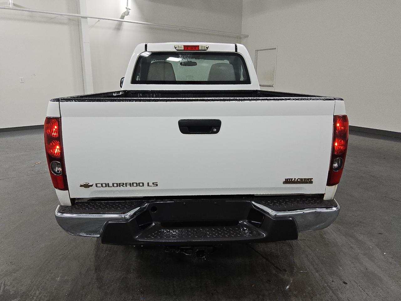 2005 Chevrolet Colorado White vin: 1GCDT146258209603 Damage: Rear Metal Bumper Chrome, Dent(S) W/No Paint Dmg, 2 To 3 Inches
