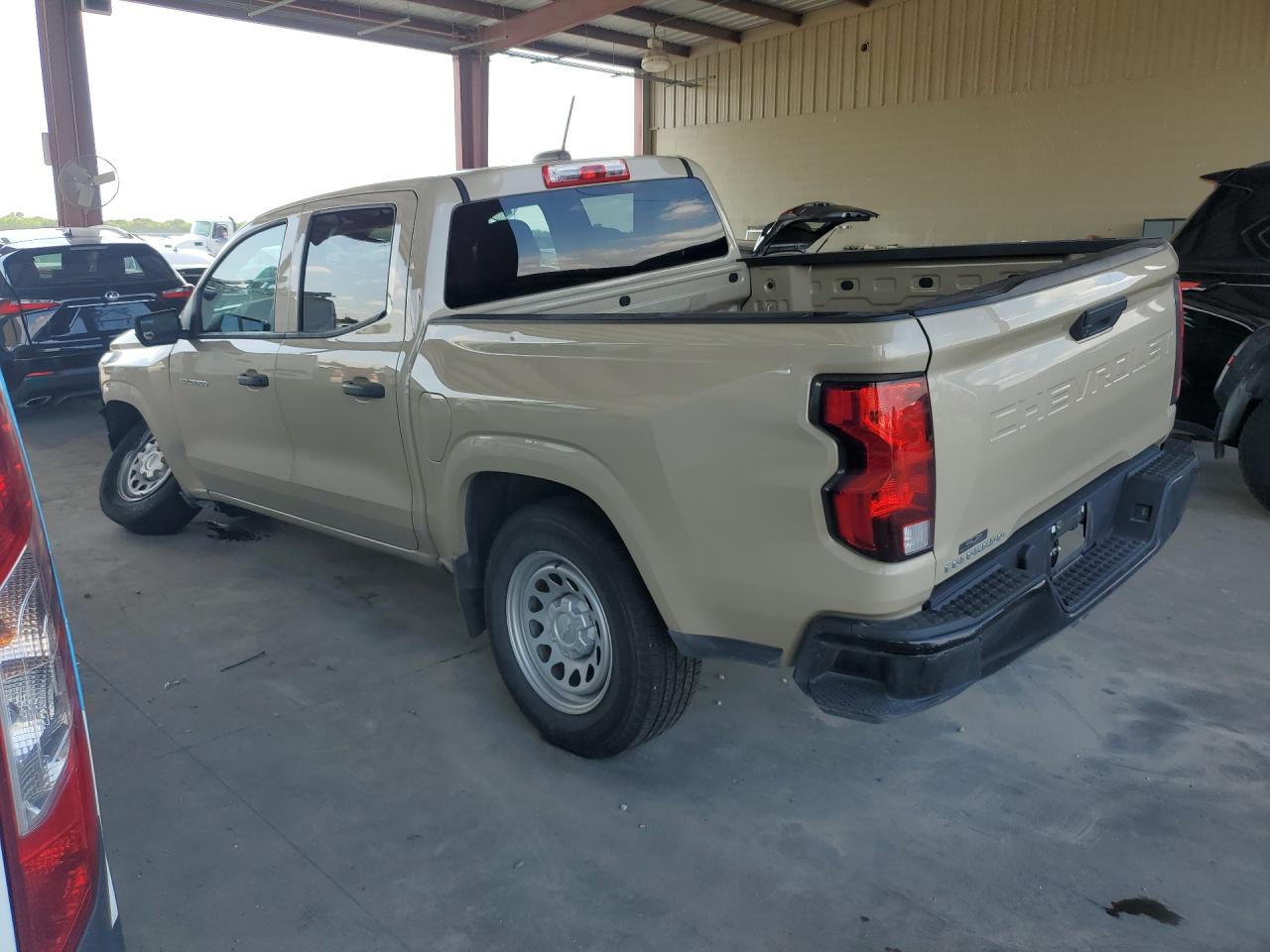 2024 Chevrolet Colorado Tan vin: 1GCGSBEC8R1144989 Damage: Rear Metal Bumper Painted, Dent(S) W/ Paint Dmg, > 12 Inches