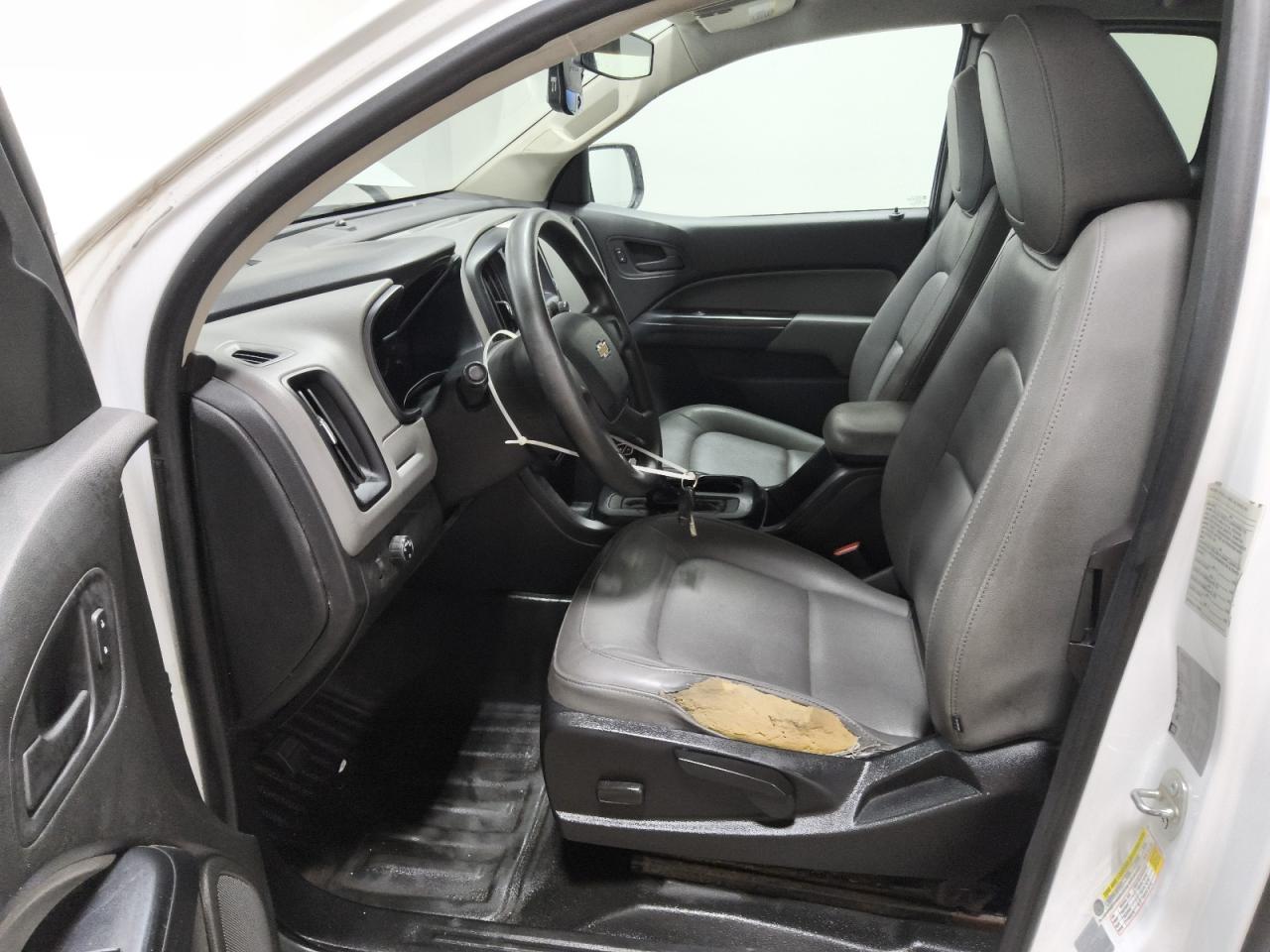 2015 Chevrolet Colorado White vin: 1GCHSAEA5F1186822 Damage: Left Front Seat, Torn, > 12 Inches