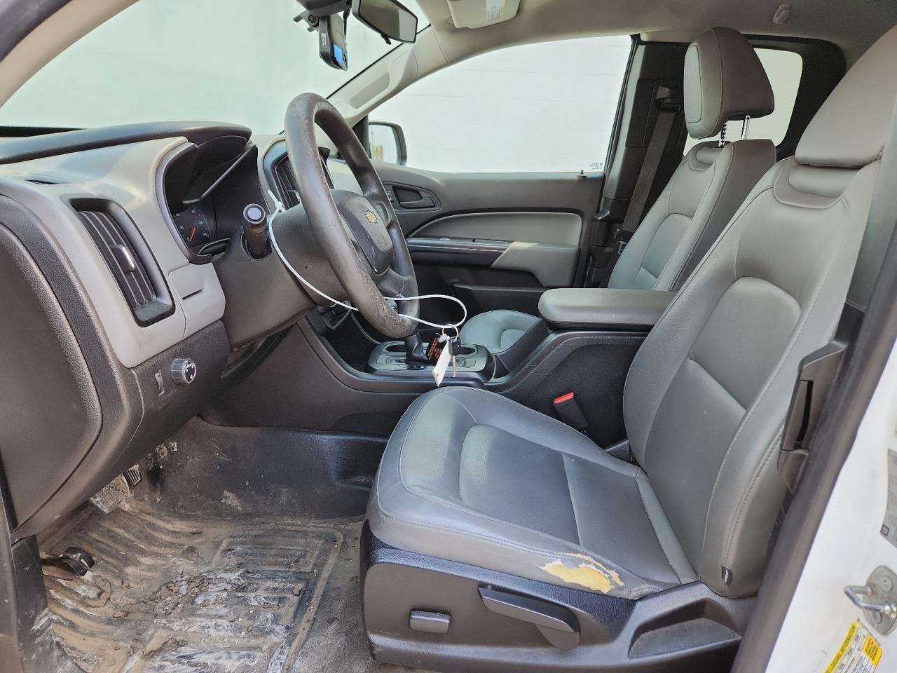 2015 Chevrolet Colorado White vin: 1GCHSAEA9F1189190 Damage: Left Front Seat Cushion, Worn, Replacement Required