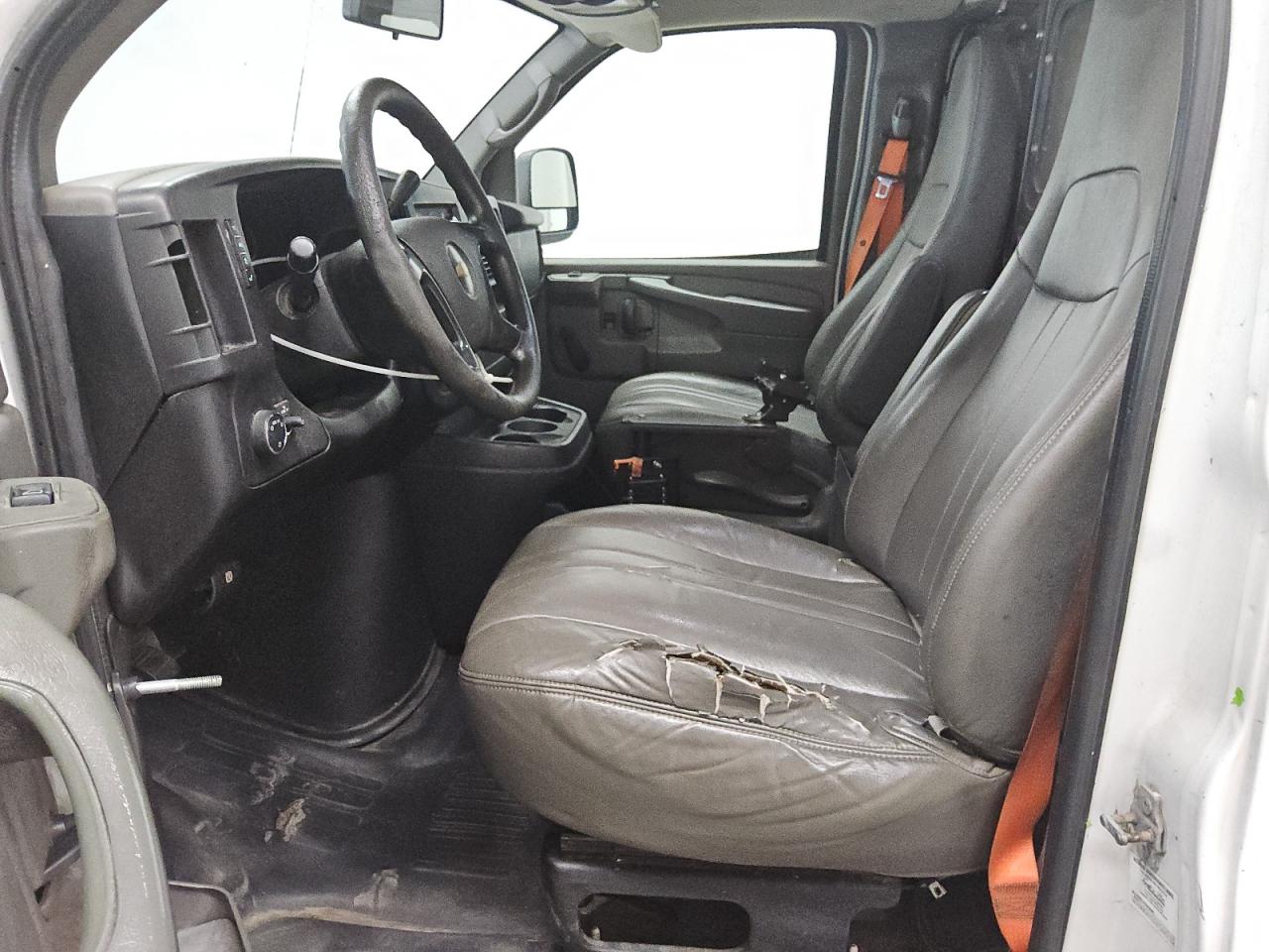 2014 Chevrolet Express G1500 White vin: 1GCSGAFX1E1165815 Damage: Left Front Seat Cushion, Torn, 9 To 10 Inches
