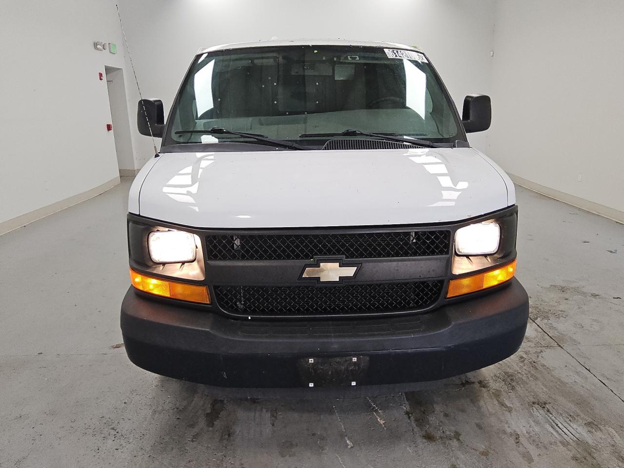 2014 Chevrolet Express G1500 White vin: 1GCSGAFX1E1165815 Damage: Front Bumper, Chipped, 2