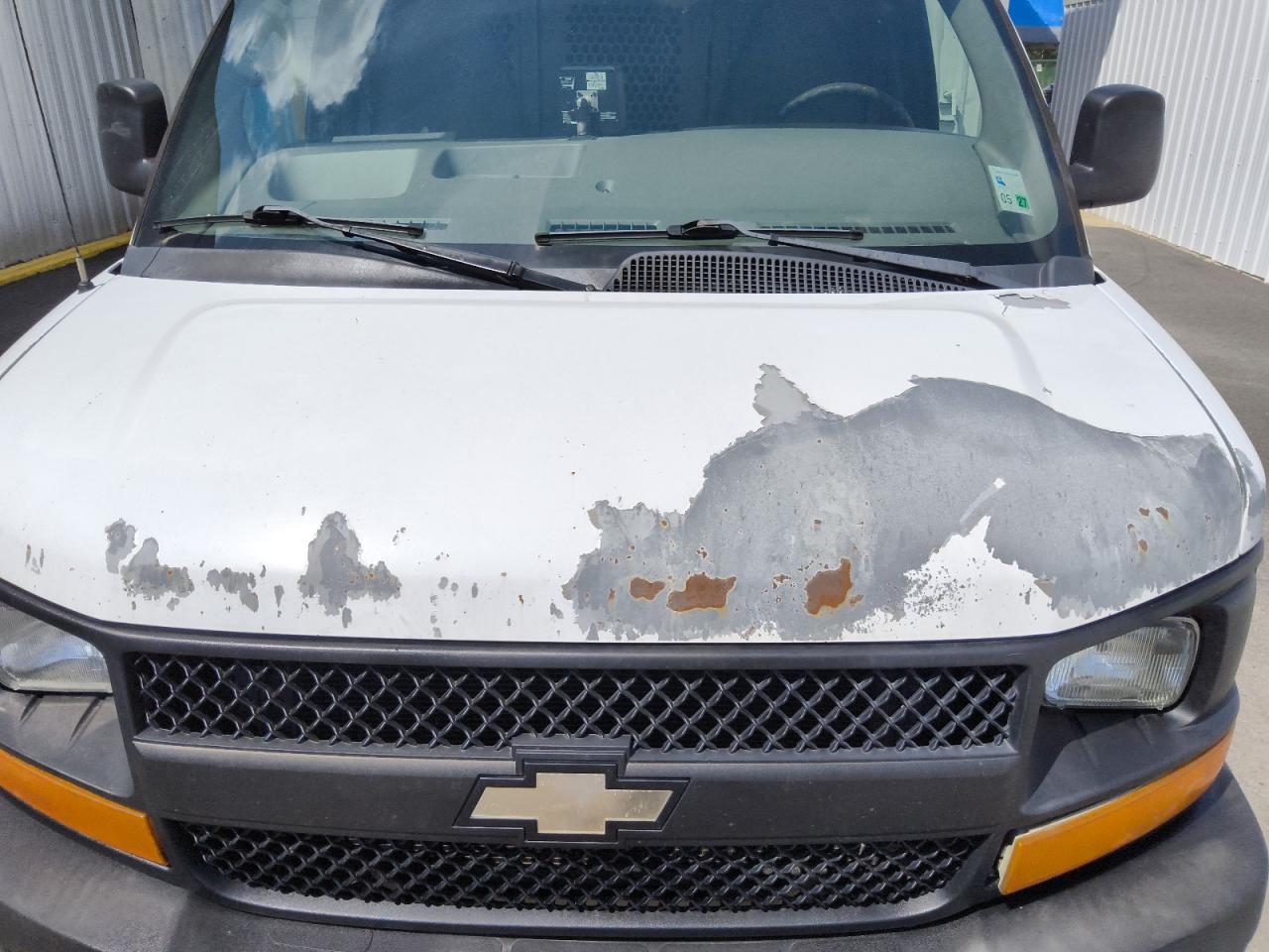 2012 Chevrolet Express G1500 White vin: 1GCSGAFX7C1157067 Damage: Hood, Rust, 2 To 3 Inches