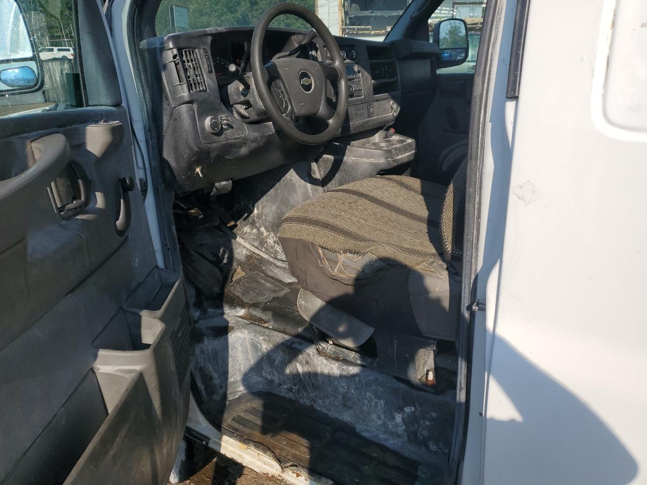 2012 Chevrolet Express G1500 White vin: 1GCSHAF48C1122444 Damage: Left Front Seat Cushion, Torn, > 12 Inches