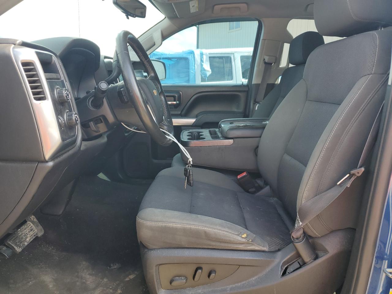 2015 Chevrolet Silverado K1500 Lt Blue vin: 1GCVKREH4FZ337990 Damage: Left Front Seat Cushion, Torn, 1 To 2 Inches