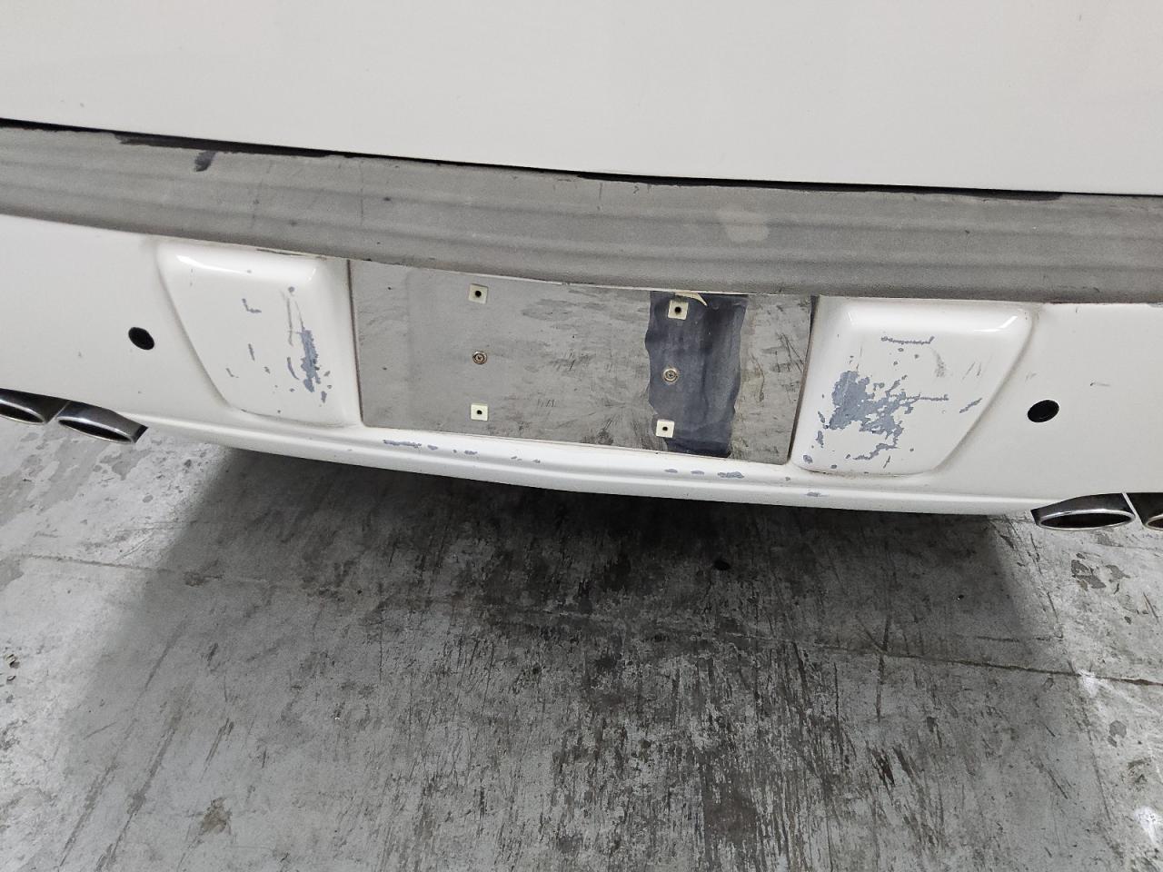 2011 Cadillac Professional Chassis White vin: 1GE7K9C65BU600027 Damage: Rear Bumper, Heavy Scratch, > 12 Inches