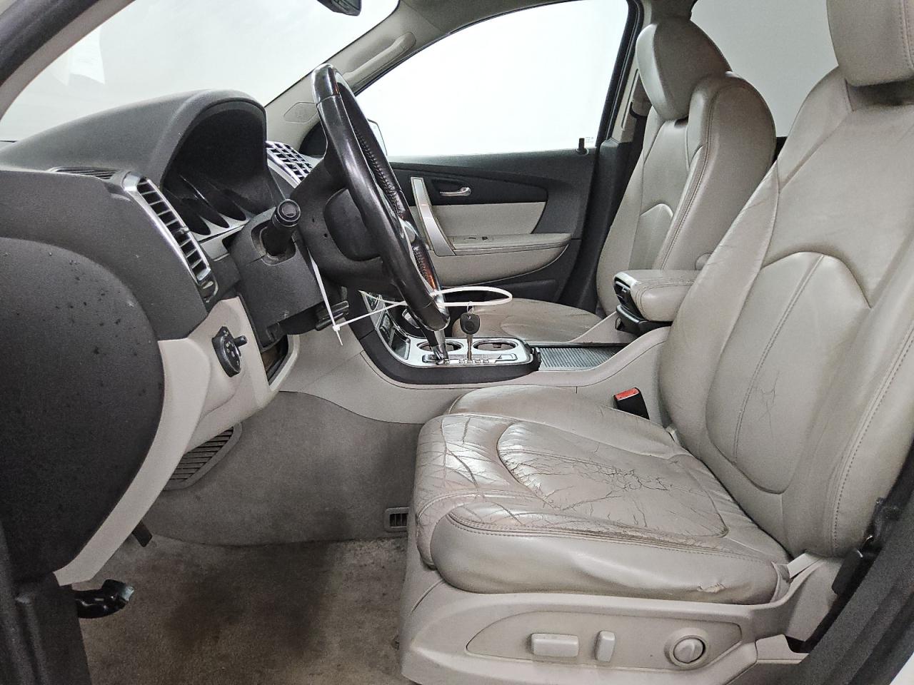 2010 Gmc Acadia Slt-1 White vin: 1GKLRMED2AJ255562 Damage: Left Front Seat, Torn, 1 To 2 Inches