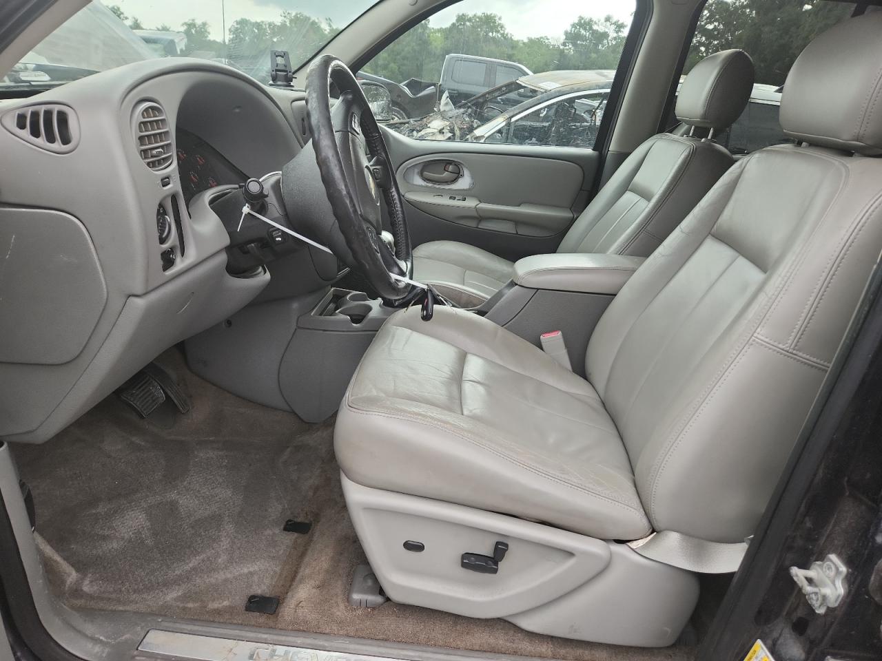 2009 Chevrolet Trailblazer Lt Black vin: 1GNDS33S492127756 Damage: Steering Wheel, Worn, Replacement Required