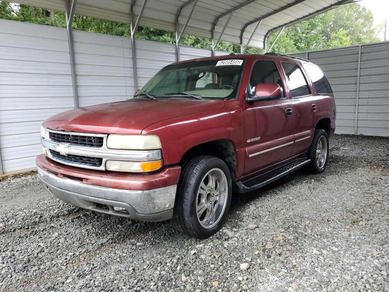 2003 Chevrolet Tahoe C1500 Burgundy vin: 1GNEC13ZX3J238764 Damage: Left Front Wheel, Aftermarket, Replacement Required
