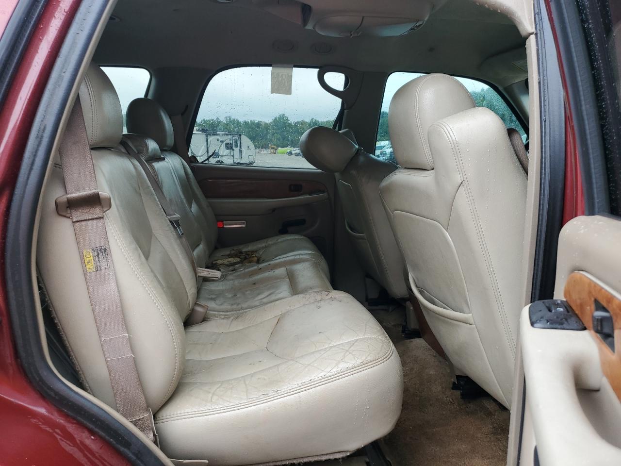 2003 Chevrolet Tahoe C1500 Burgundy vin: 1GNEC13ZX3J238764 Damage: Left Rear Seat, Worn, Replacement Required